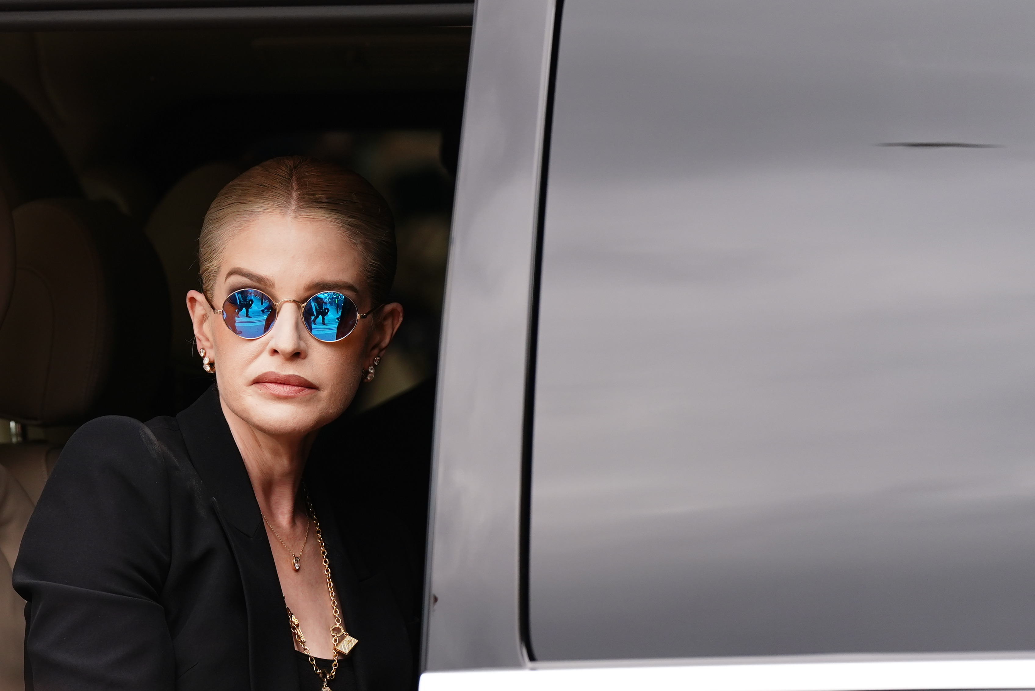 Kelly Osbourne leaves after laying flowers and viewing the messages and floral tributes left at the Black Sabbath Bridge bench on Broad Street in Birmingham in memory of Black Sabbath frontman Ozzy Osbourne on Wednesday July 30, 2025. | Source: Getty Images
