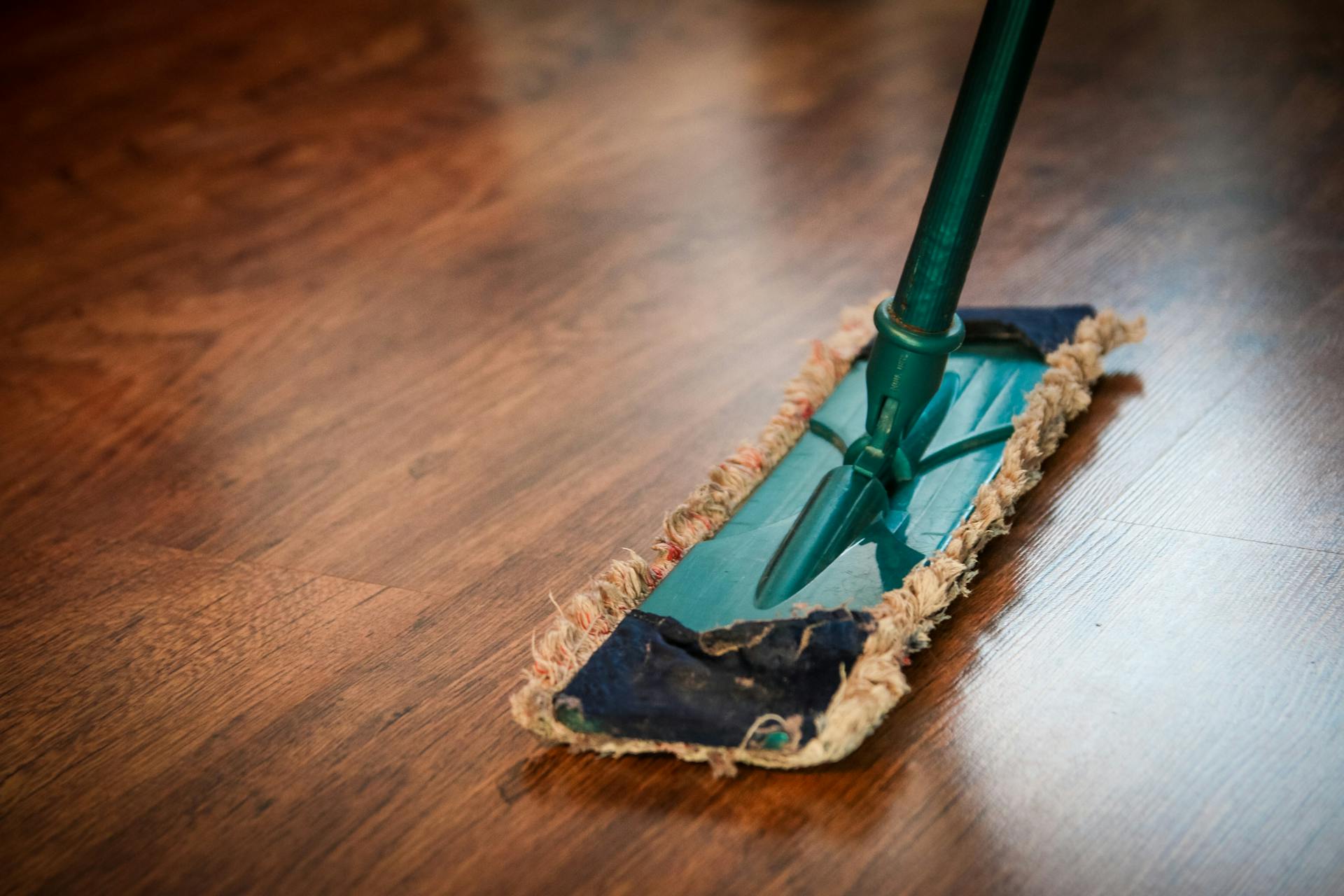 A person mopping a floor | Source: Pexels