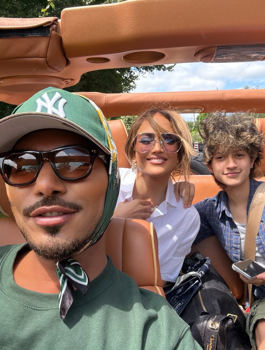 Stevie Mackey, Jennifer Lopez, and Emme Muñiz pose in a photo shared on August 24, 2025. | Source: Instagram/jlo