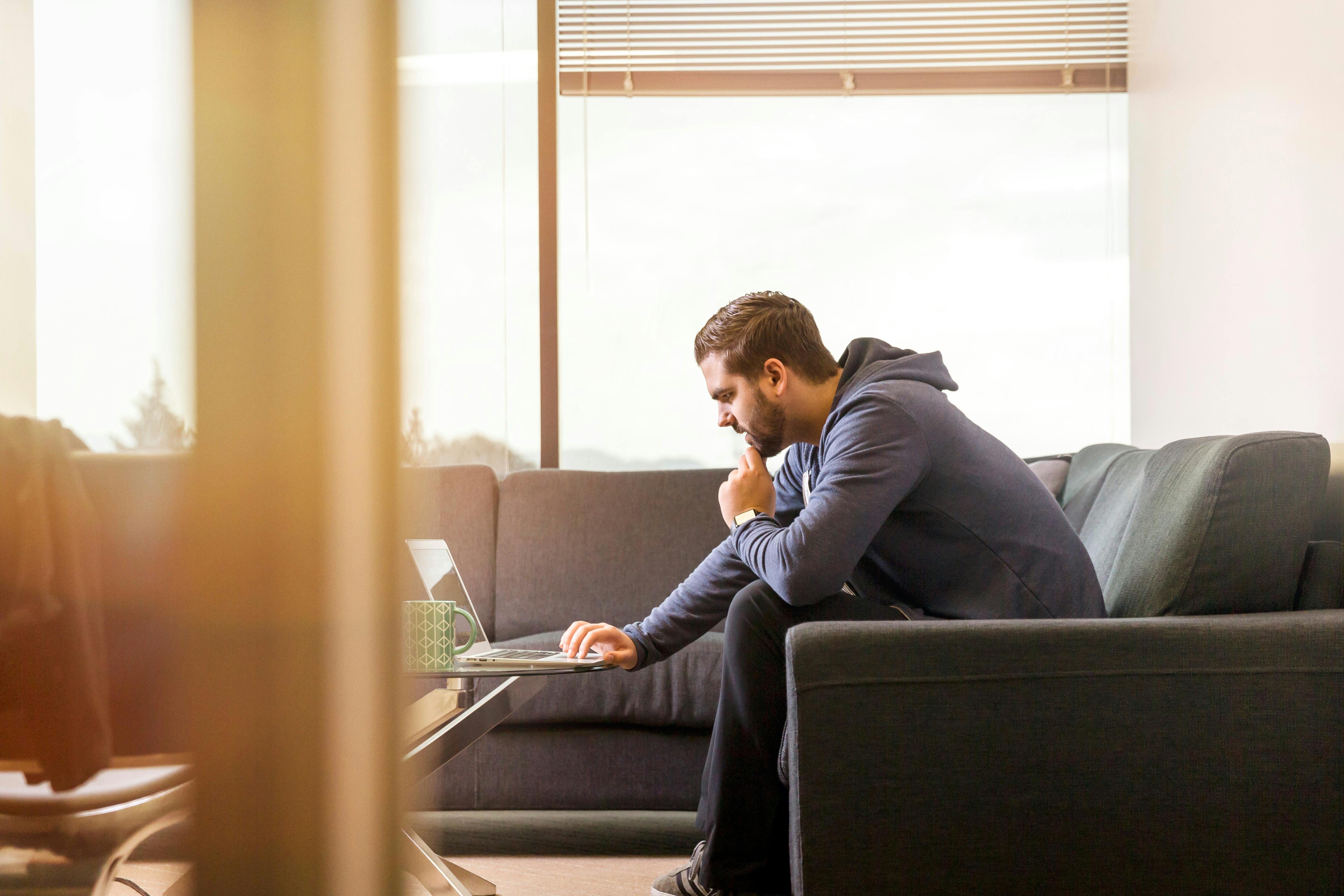 A man sitting on a couch | Source: Pexels