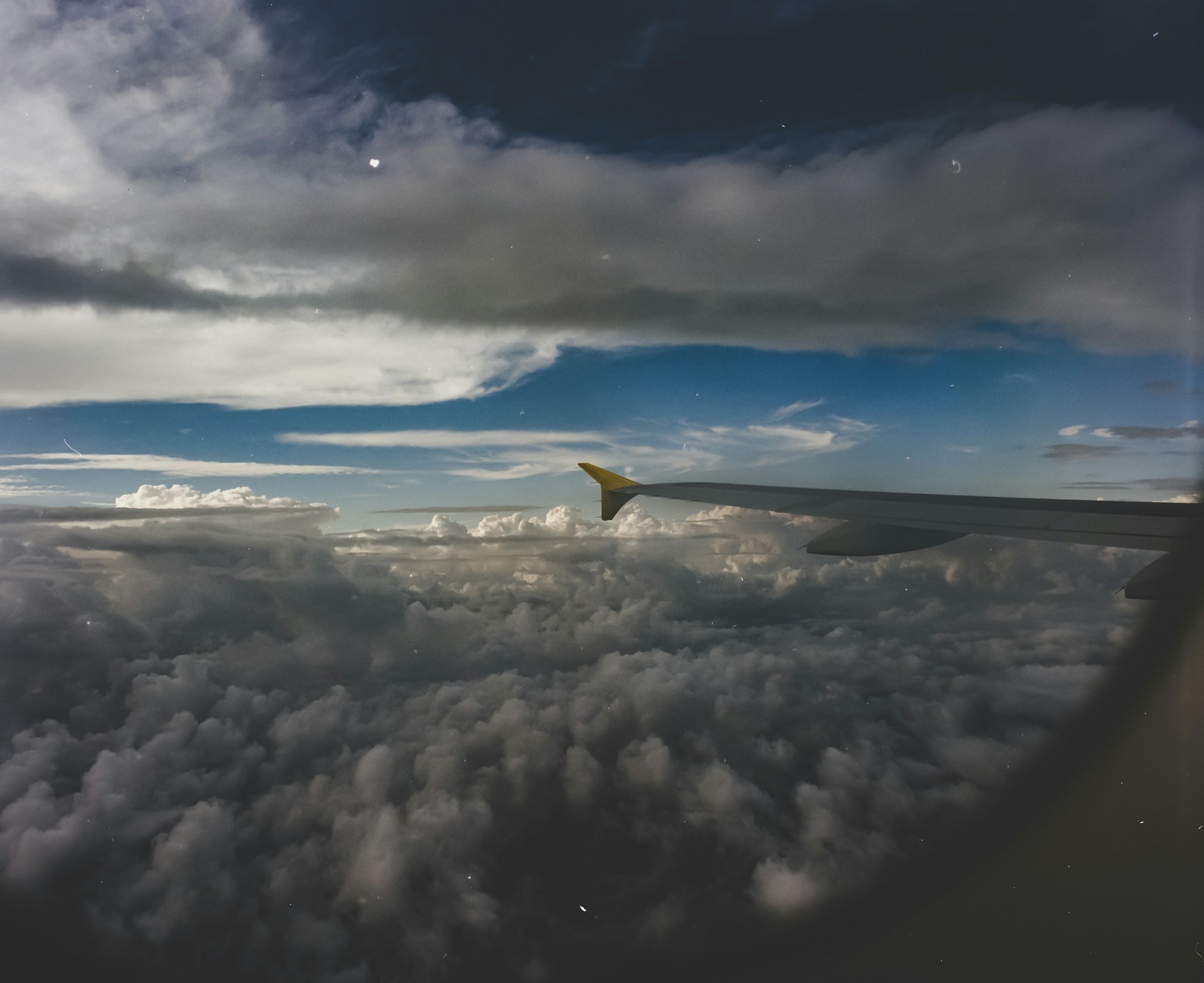 A view of clouds through an airplane window | Source: Unsplash