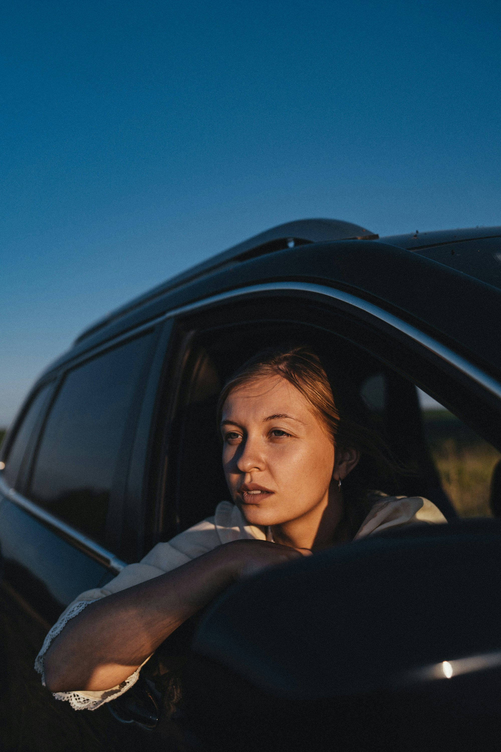 A woman sitting in a car | Source: Unsplash