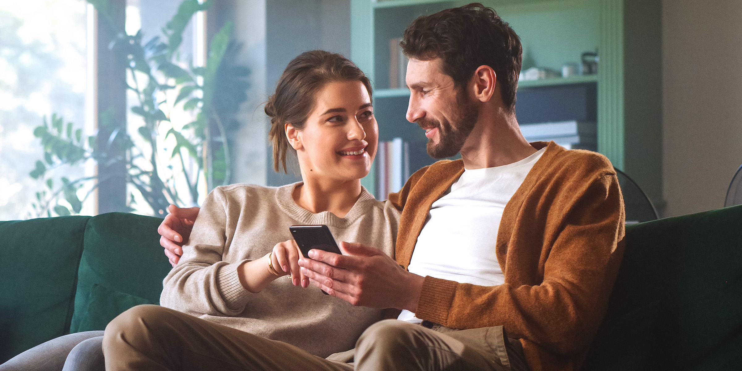 A couple sitting on the couch | Source: Shutterstock