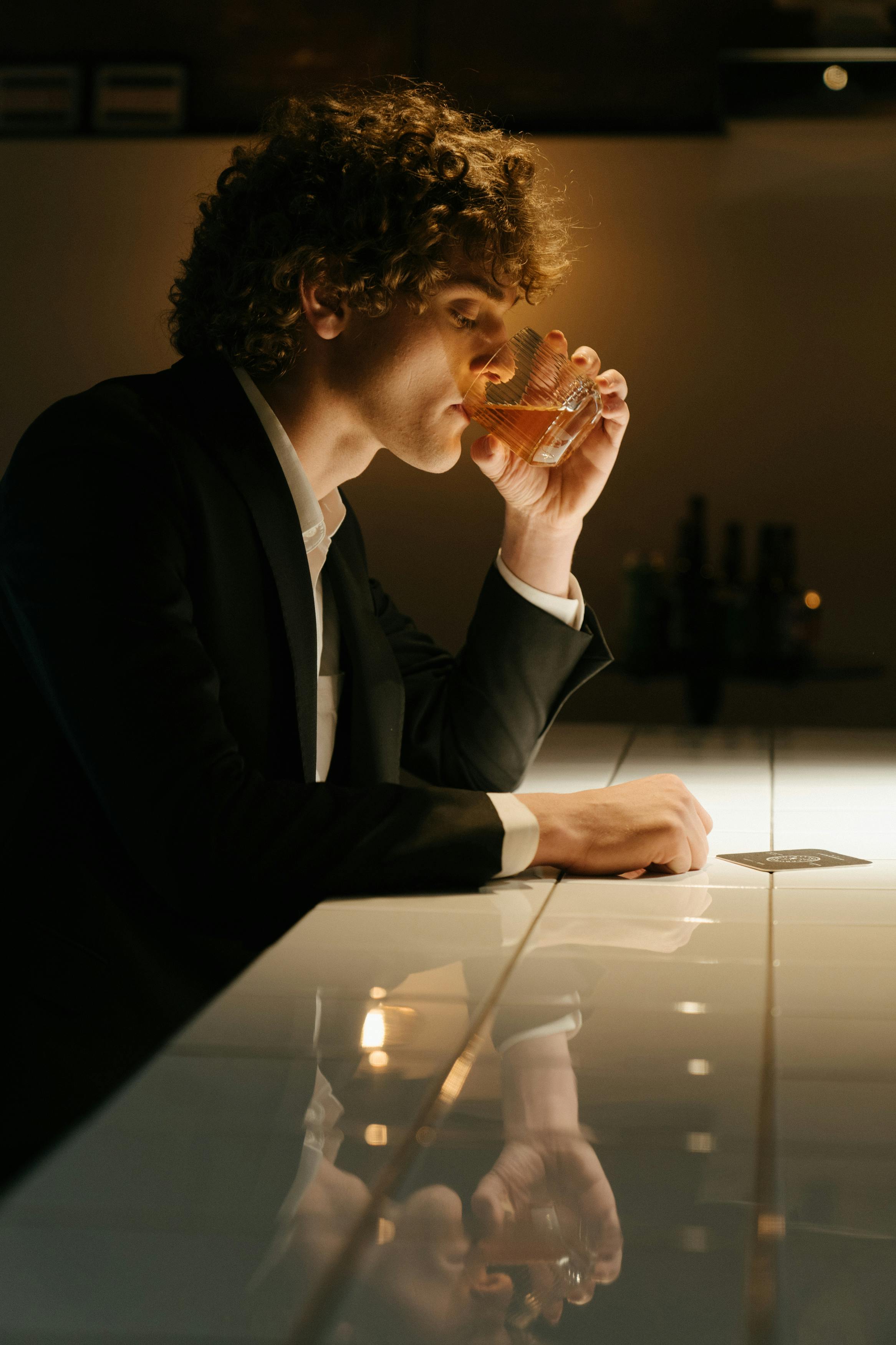 A man sitting at a bar | Source: Midjourney