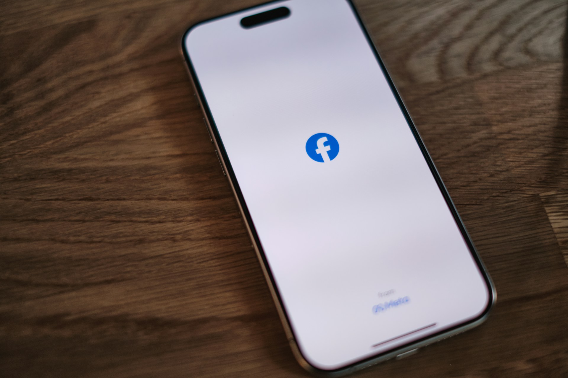 A phone with the Facebook app open | Source: Unsplash