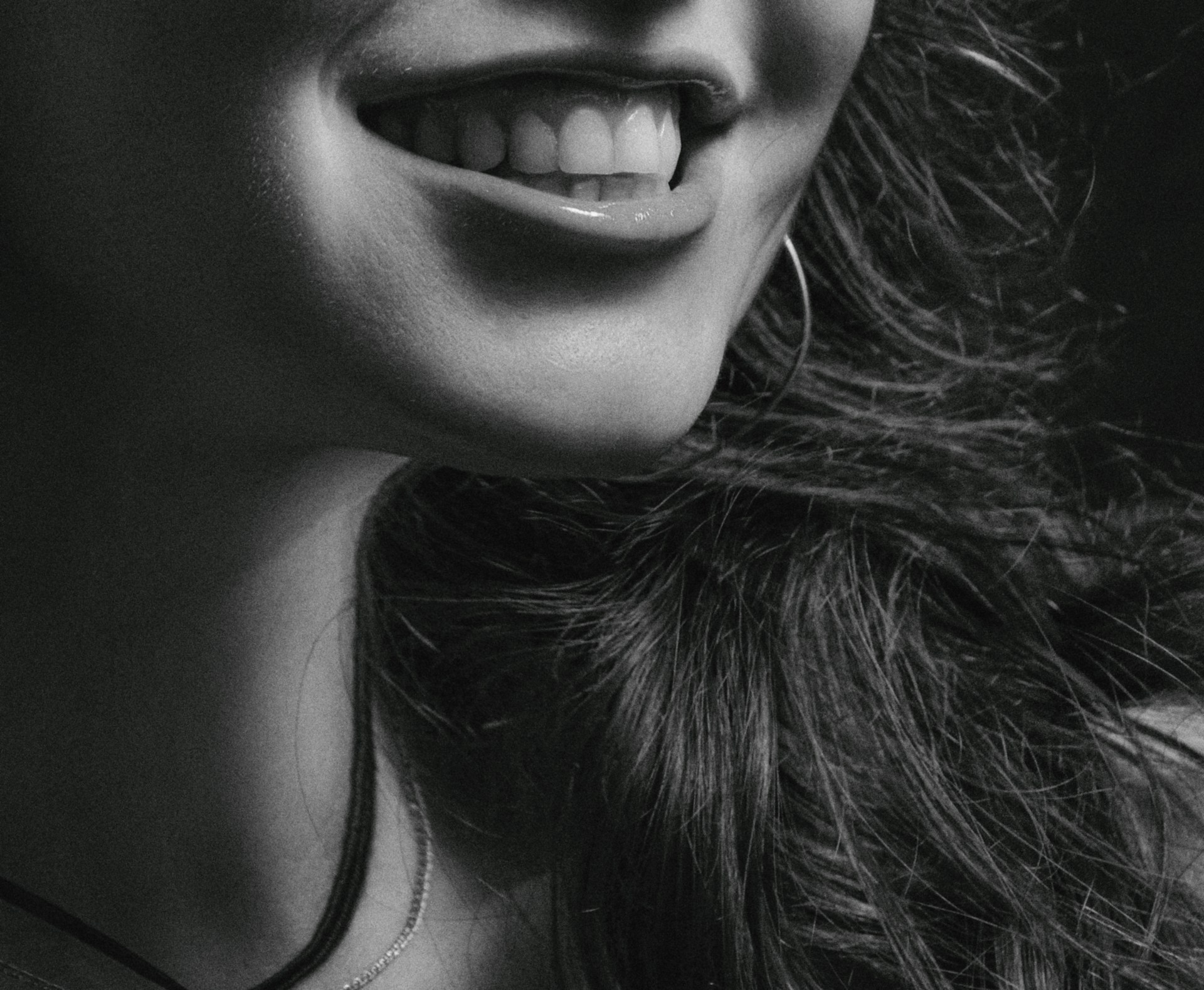 Grayscale shot of a woman smiling | Source: Unsplash