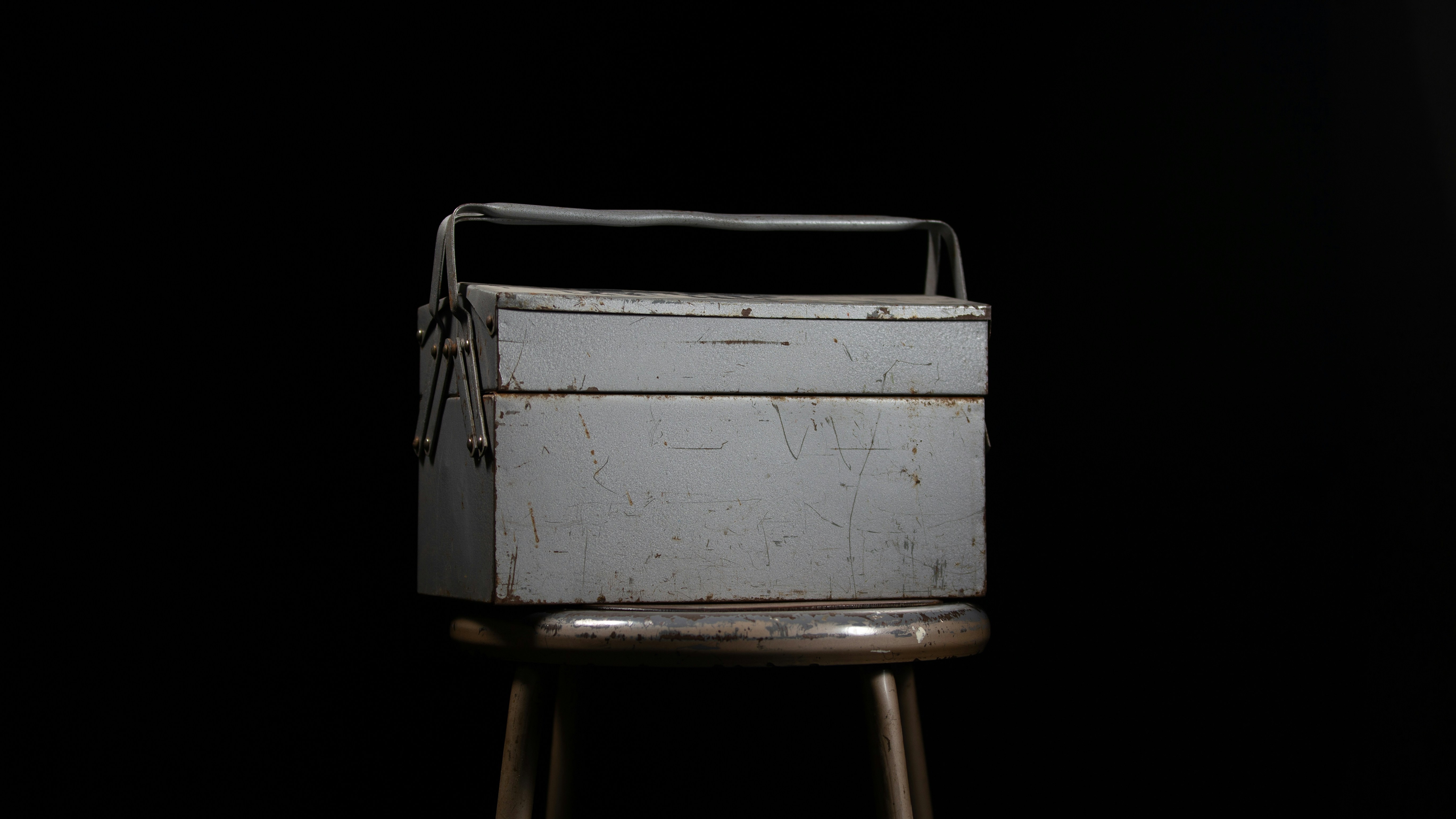 A metal toolbox on a stool | Source: Pexels