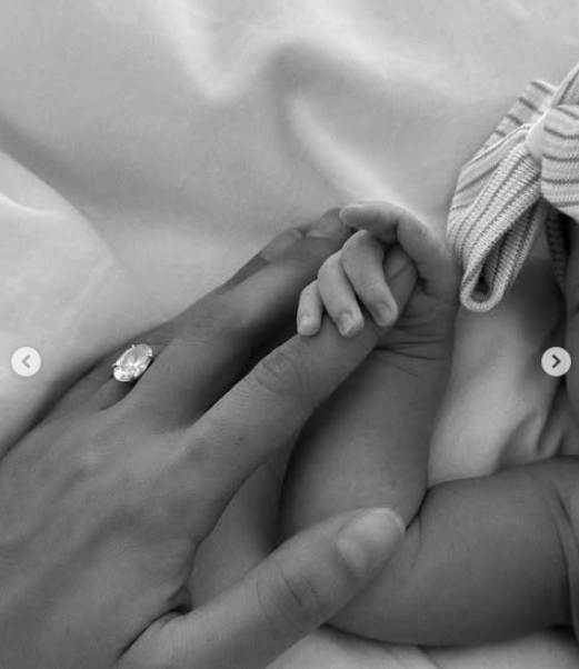 An up-close shot of Christen Harper and Romy, dated July 2025 | Source: Instagram/christengoffandjaredgoff