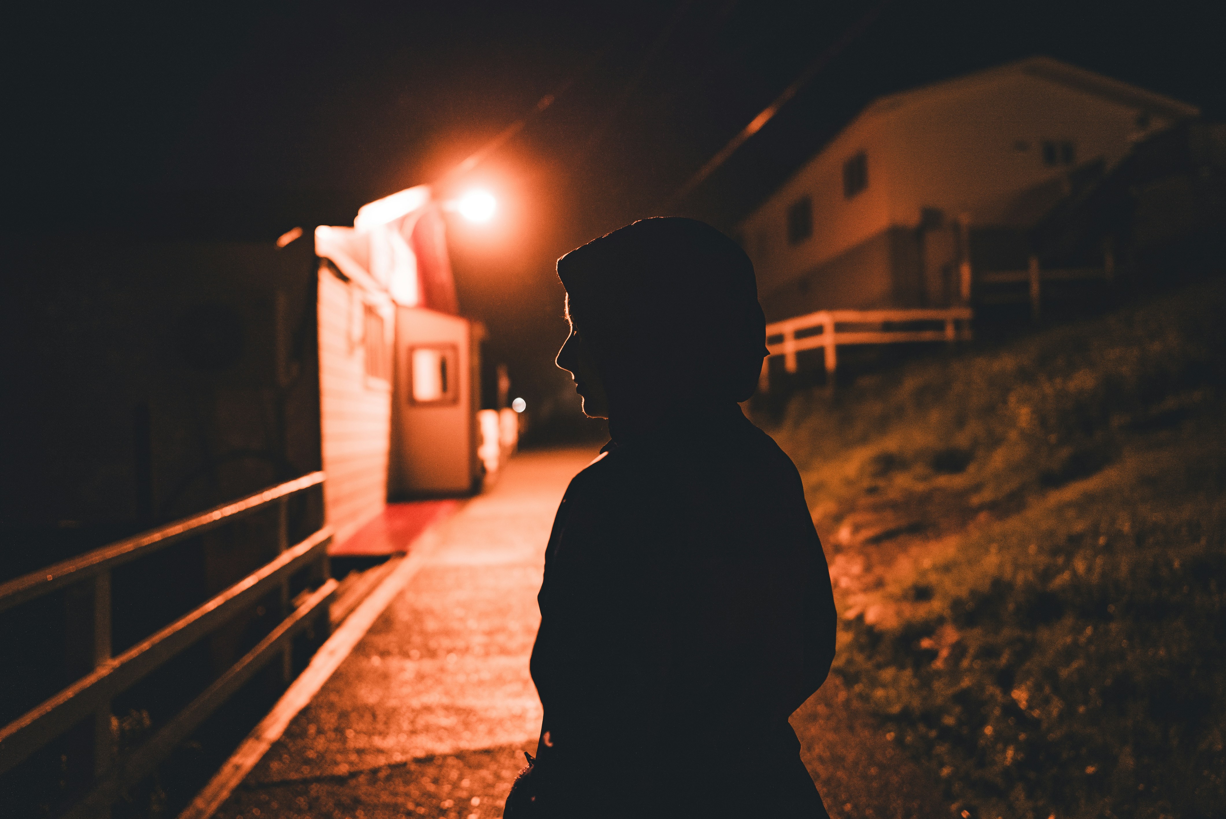 A person standing outside at night | Source: Unsplash