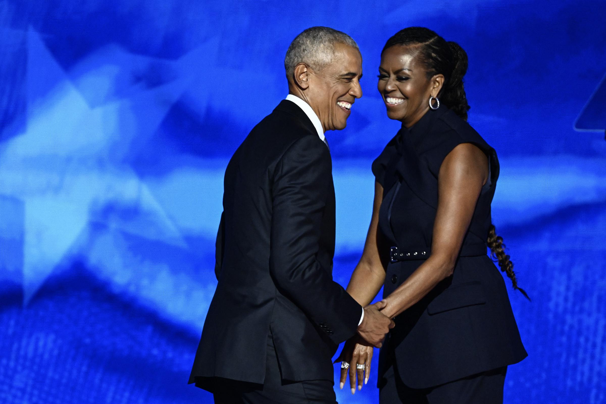 Former US President Barack Obama arrives onstage after his wife and former First Lady Michelle Obama introduced him on the second day of the Democratic National Convention (DNC) at the United Center in Chicago, Illinois, on August 20, 2024. | Source: Getty Images