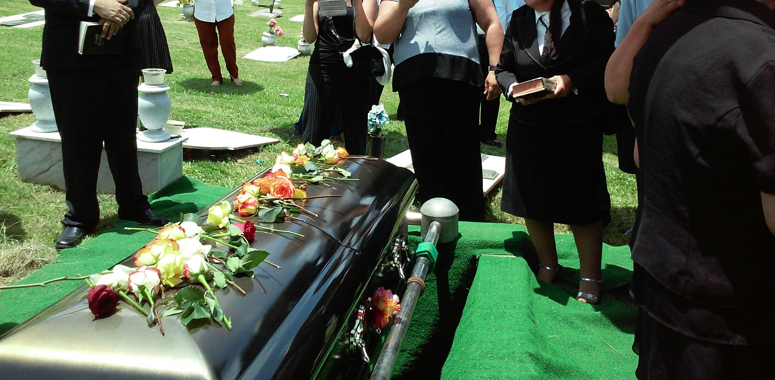 People attending a burial service | Source: Unsplash