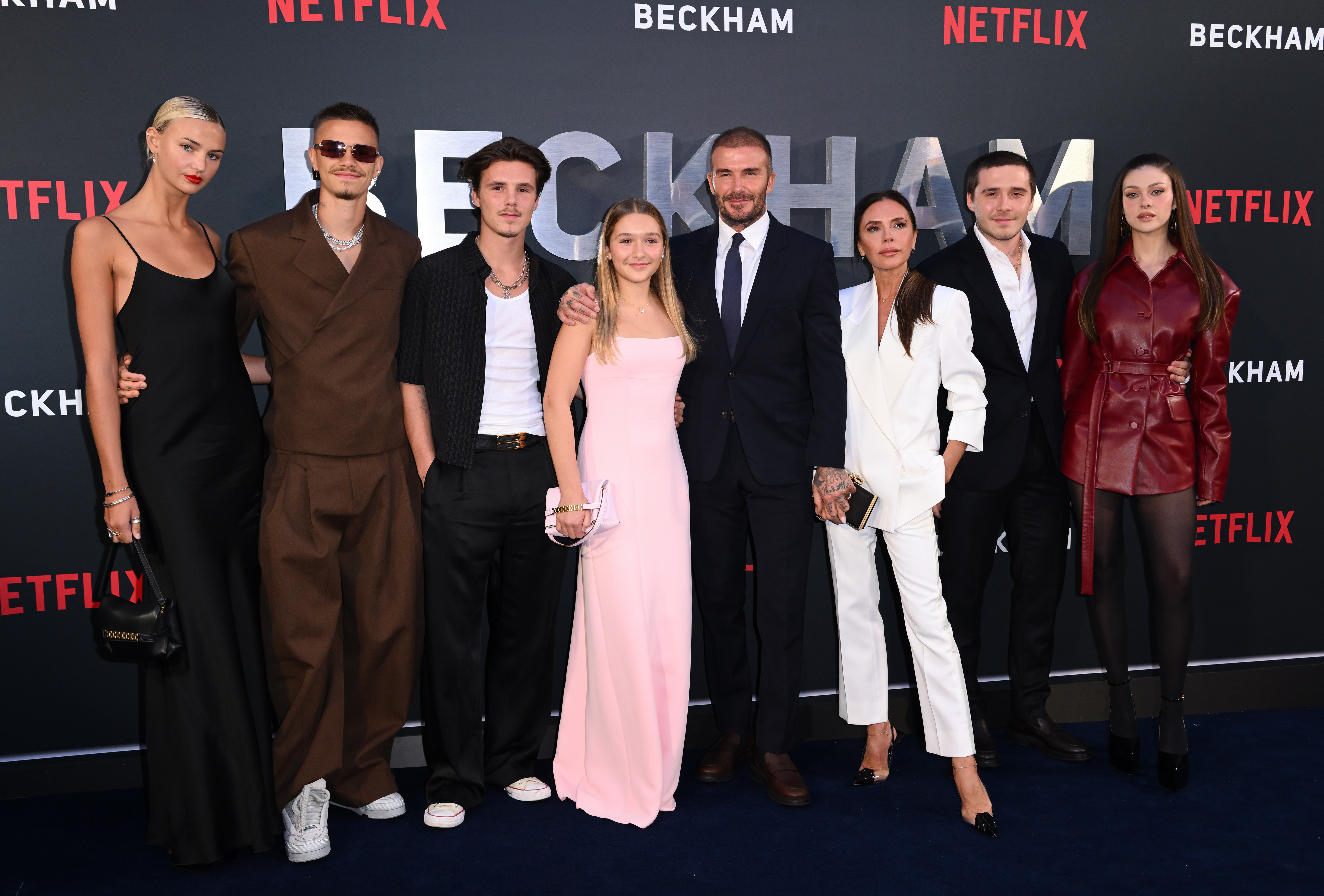 (L-R) Mia Regan, Romeo Beckham, Cruz Beckham, Harper Beckham, David Beckham, Victoria Beckham, Brooklyn Beckham and Nicola Peltz attend the Netflix 'Beckham' UK Premiere at The Curzon Mayfair on October 3, 2023, in London, England. | Source: Getty Images