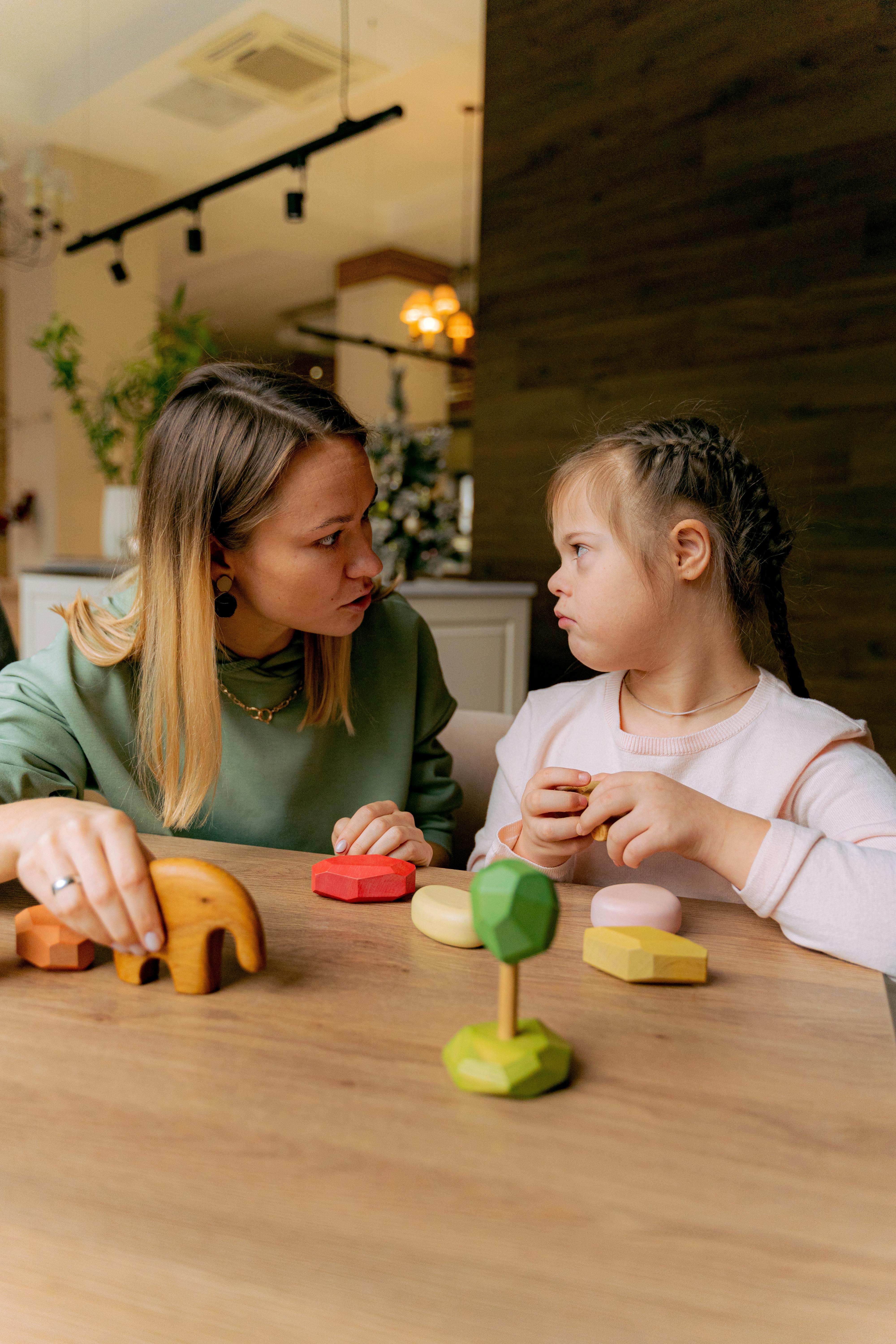 Mother playing with her daughter | Source: Pexels