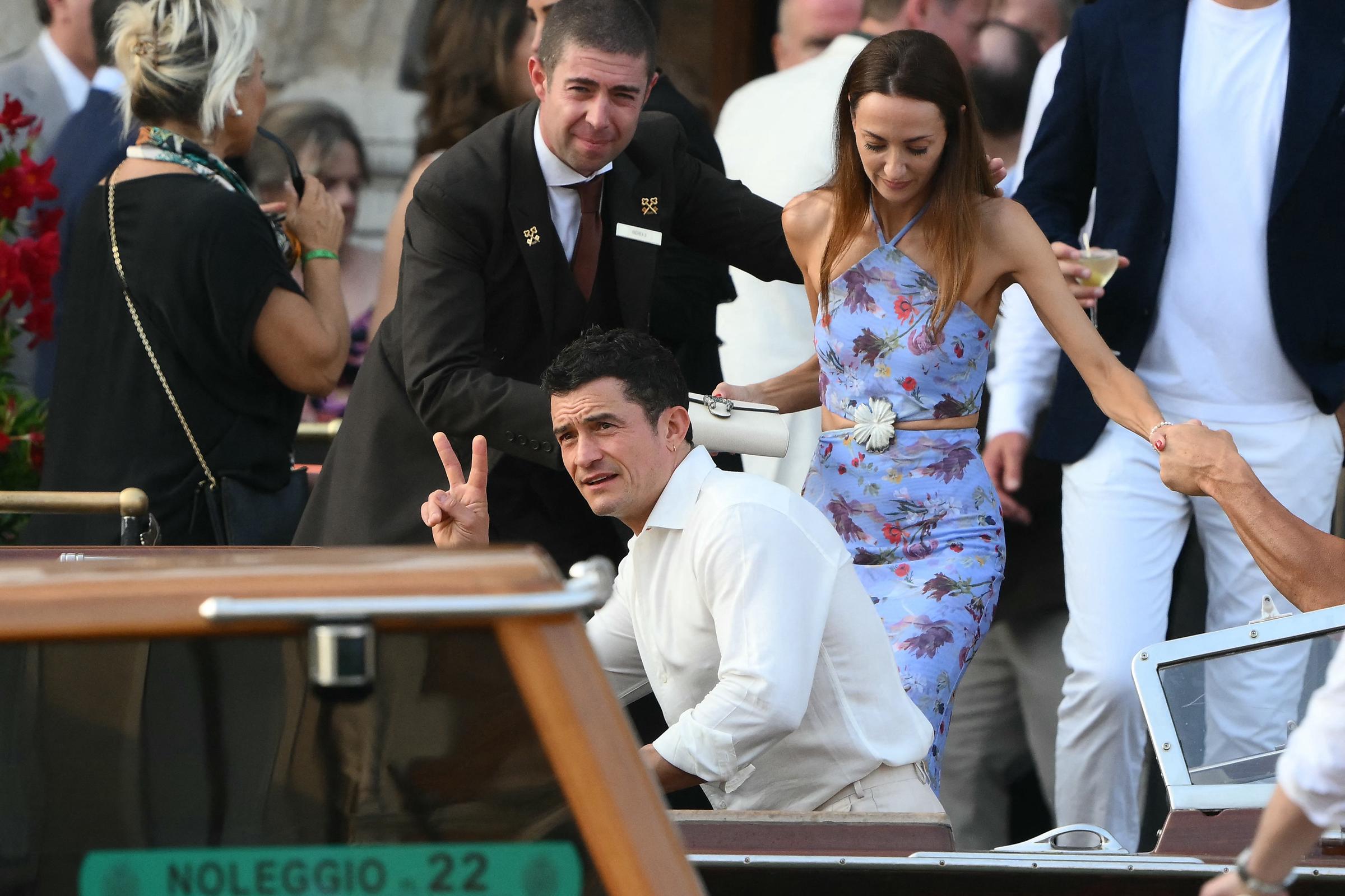 Orlando Bloom and guest get on a taxi boat at the Gritti Palace Hotel ahead of the wedding of Amazon's founder Jeff Bezos with Lauren Sanchez in Venice on June 26, 2025 | Source: Getty Images
