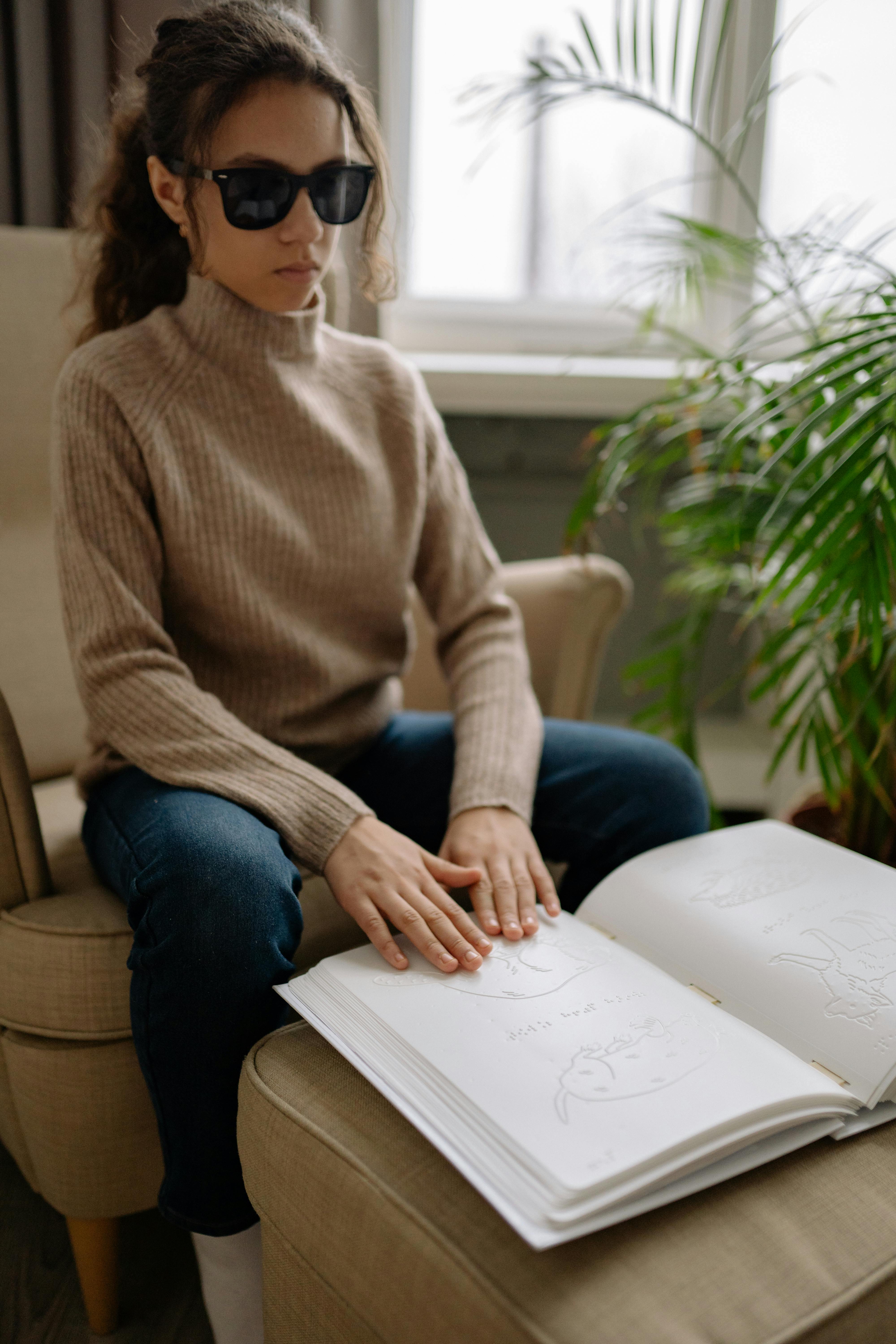 A girl reading Braille | Source: Pexels
