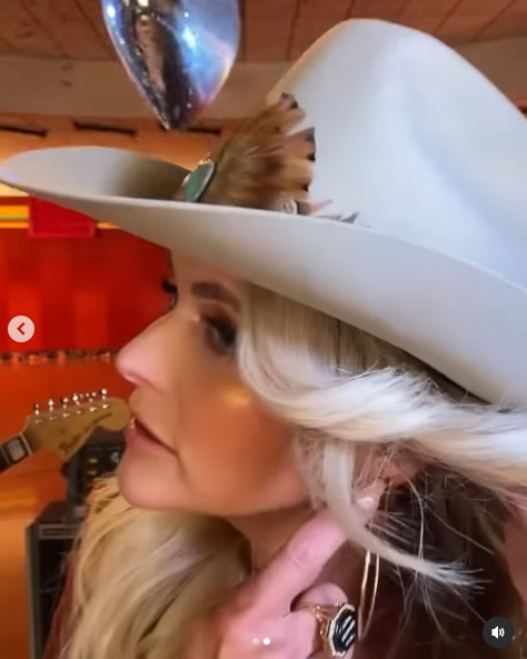 Miranda Lambert showcasing Dolly Parton's hoop earrings she wore to pay homage to the legendary singer from a video posted on September 4, 2025 | Source: Instagram/countryrebel