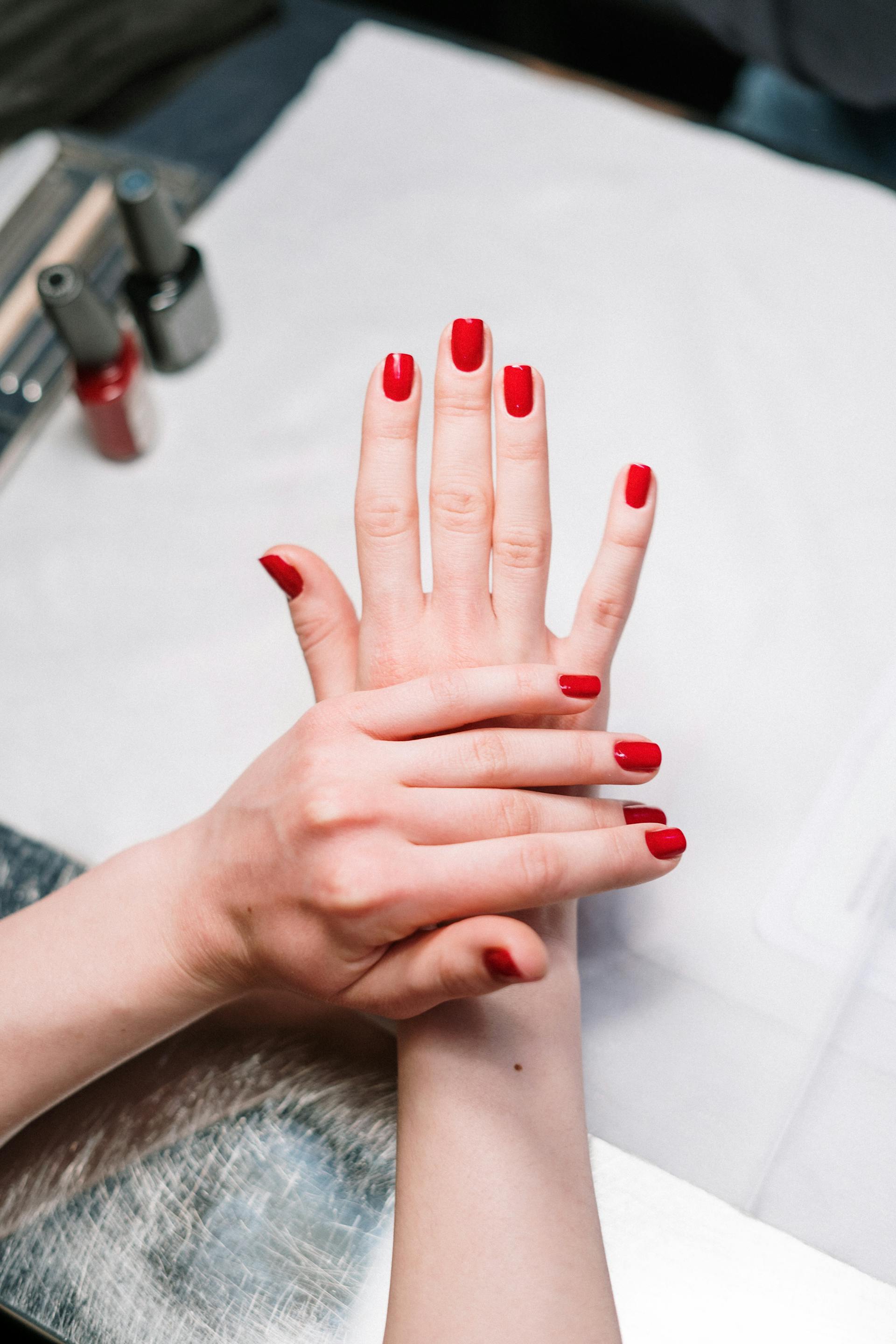 A woman wearing red nail polish | Source: Pexels