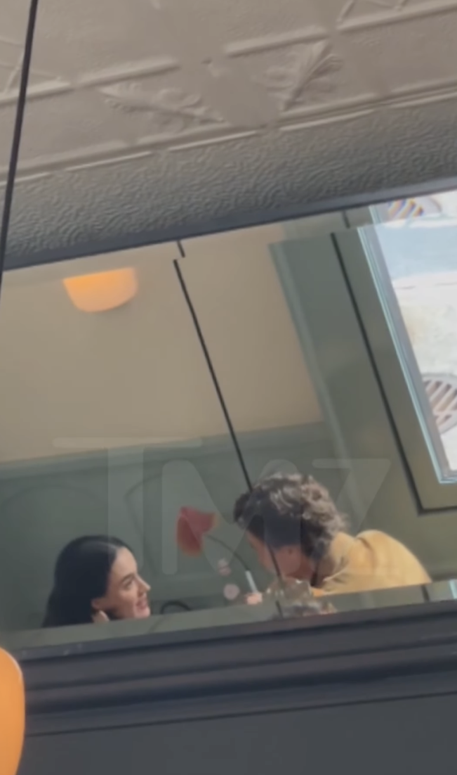 Katy Perry and Justin Trudeau dining in Canada, posted on July 29, 2025. | Source: Instagram/tmz_tv