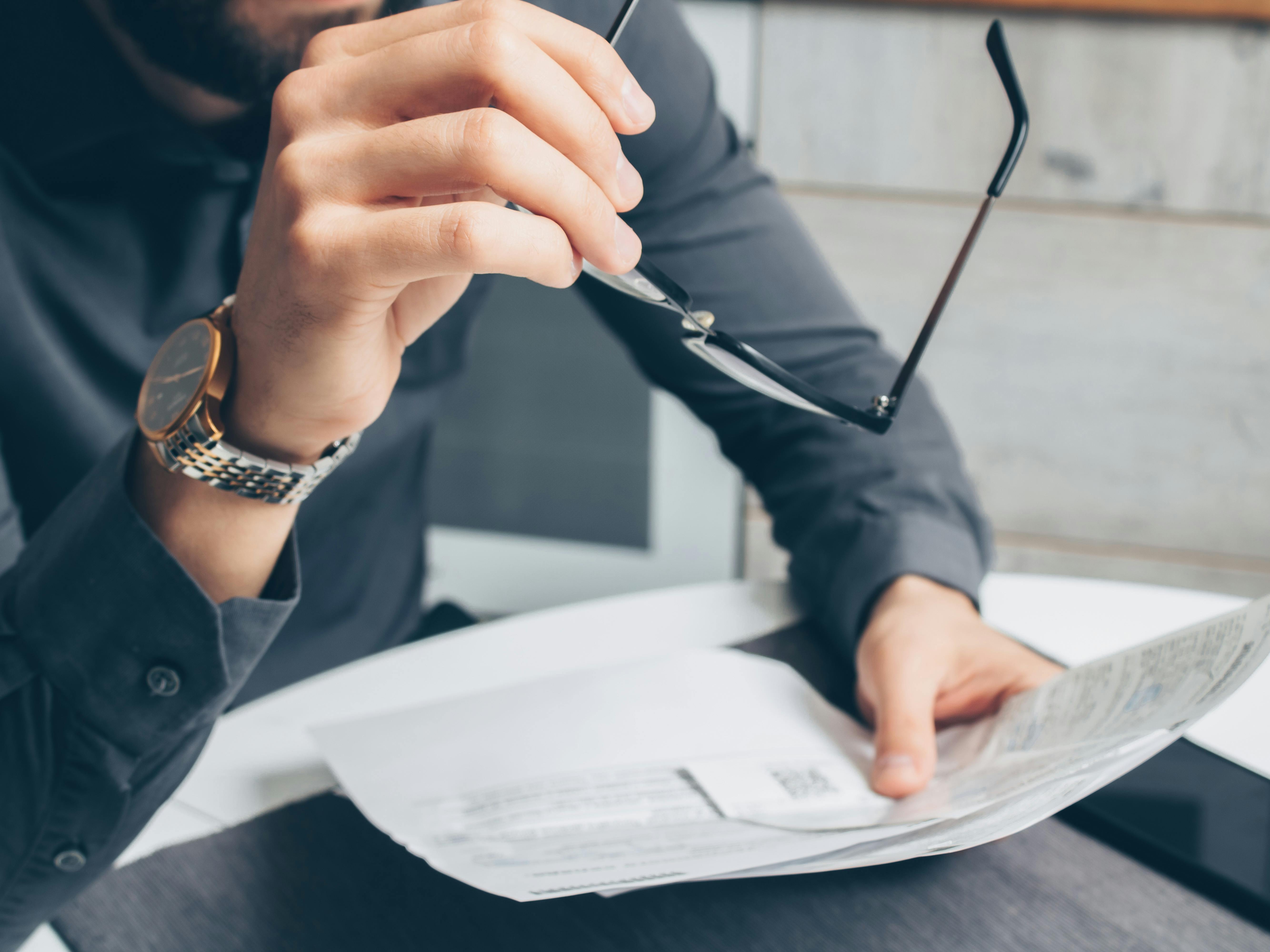 A person holding documents | Source: Pexels