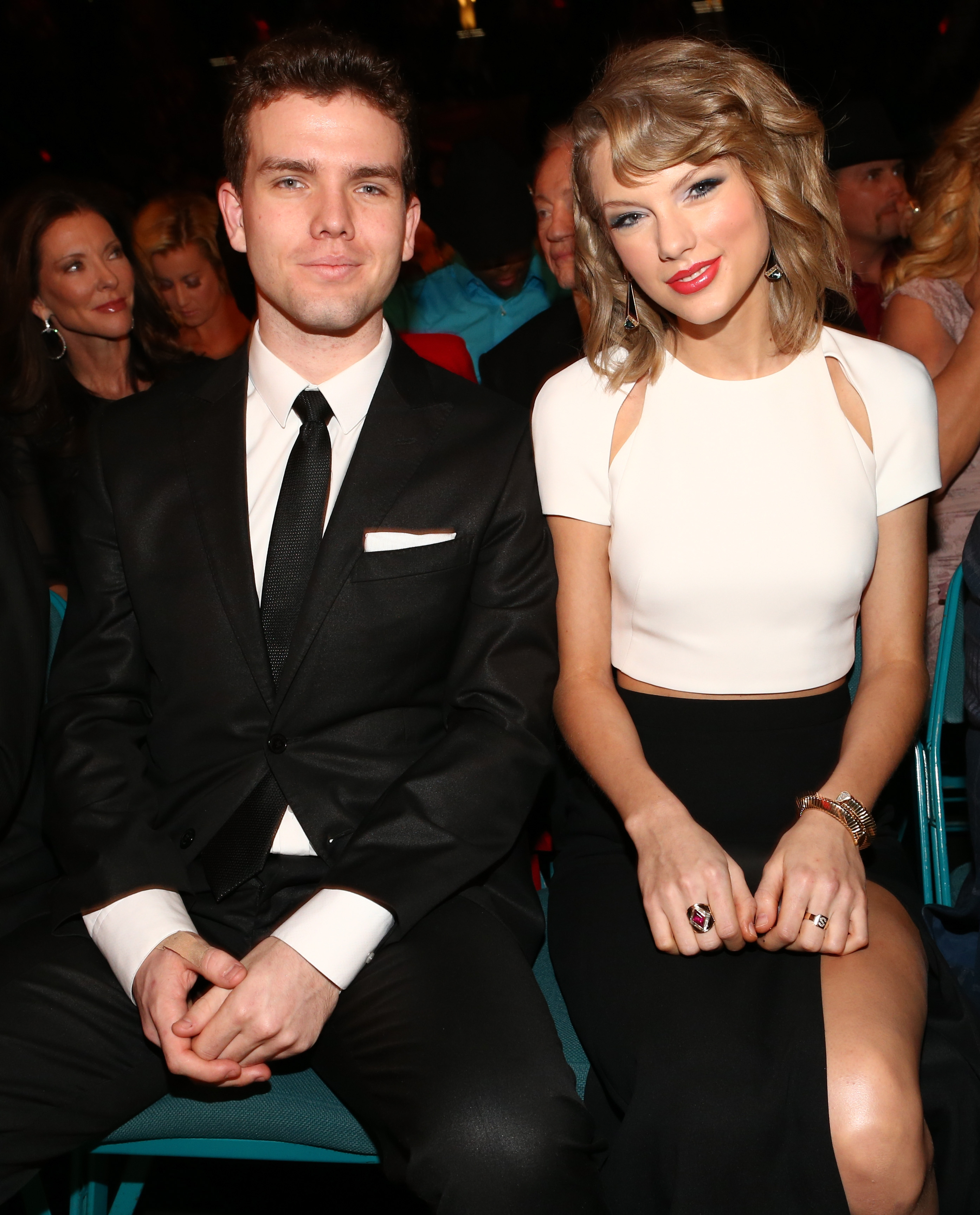 Taylor Swift (L) and Austin Swift attend The Weinstein Company & Netflix's 2014 Golden Globes After Party presented by Bombardier, FIJI Water, Lexus, Laura Mercier, Marie Claire and Yucaipa Films at The Beverly Hilton Hotel on January 12, 2014, in Beverly Hills, California. | Source: Getty Images