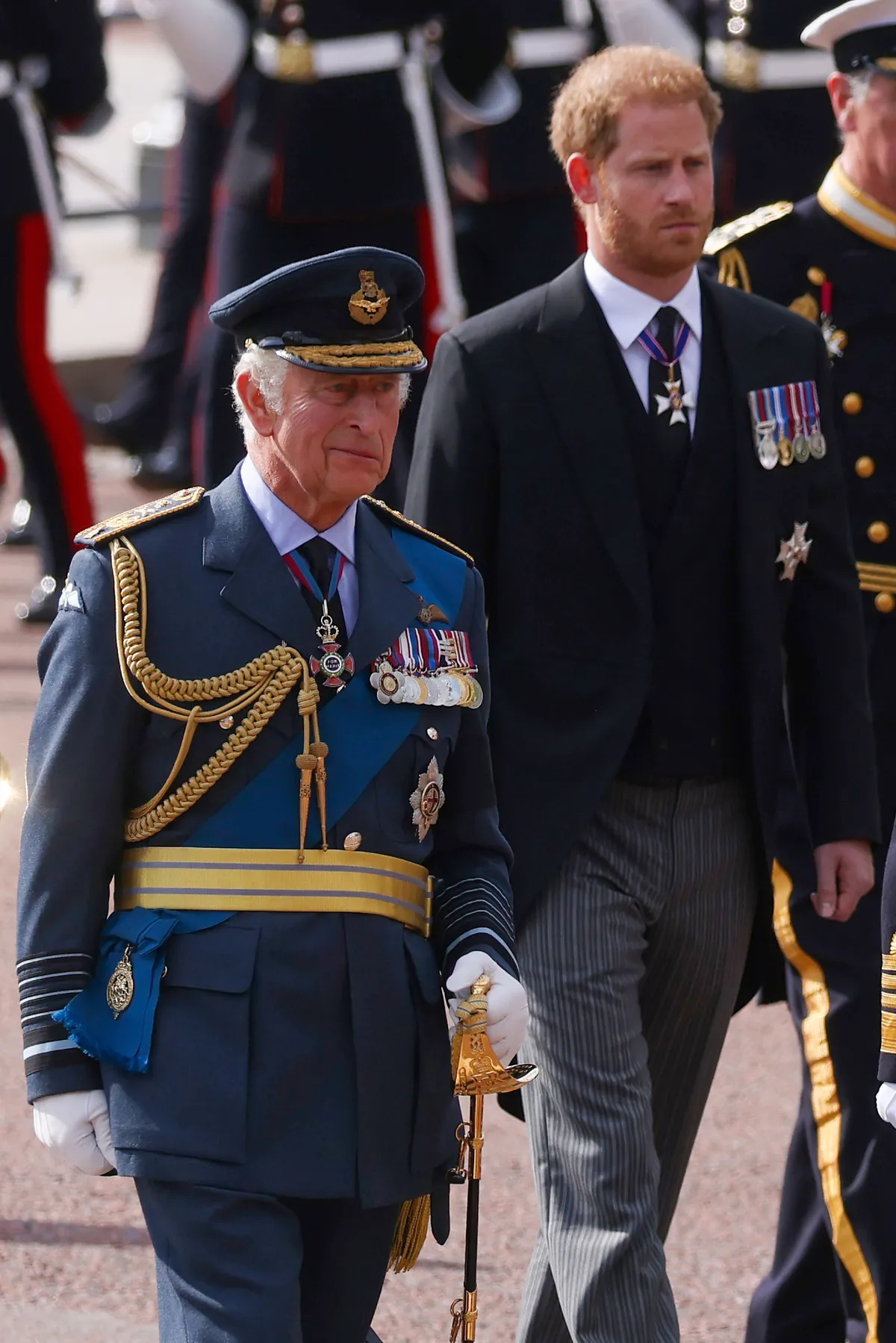 King Charles III and Prince Harry follow the cortege carrying the coffin of Queen Elizabeth II to Westminster Hall on September 14, 2022, in London, England. | Source: Getty Images