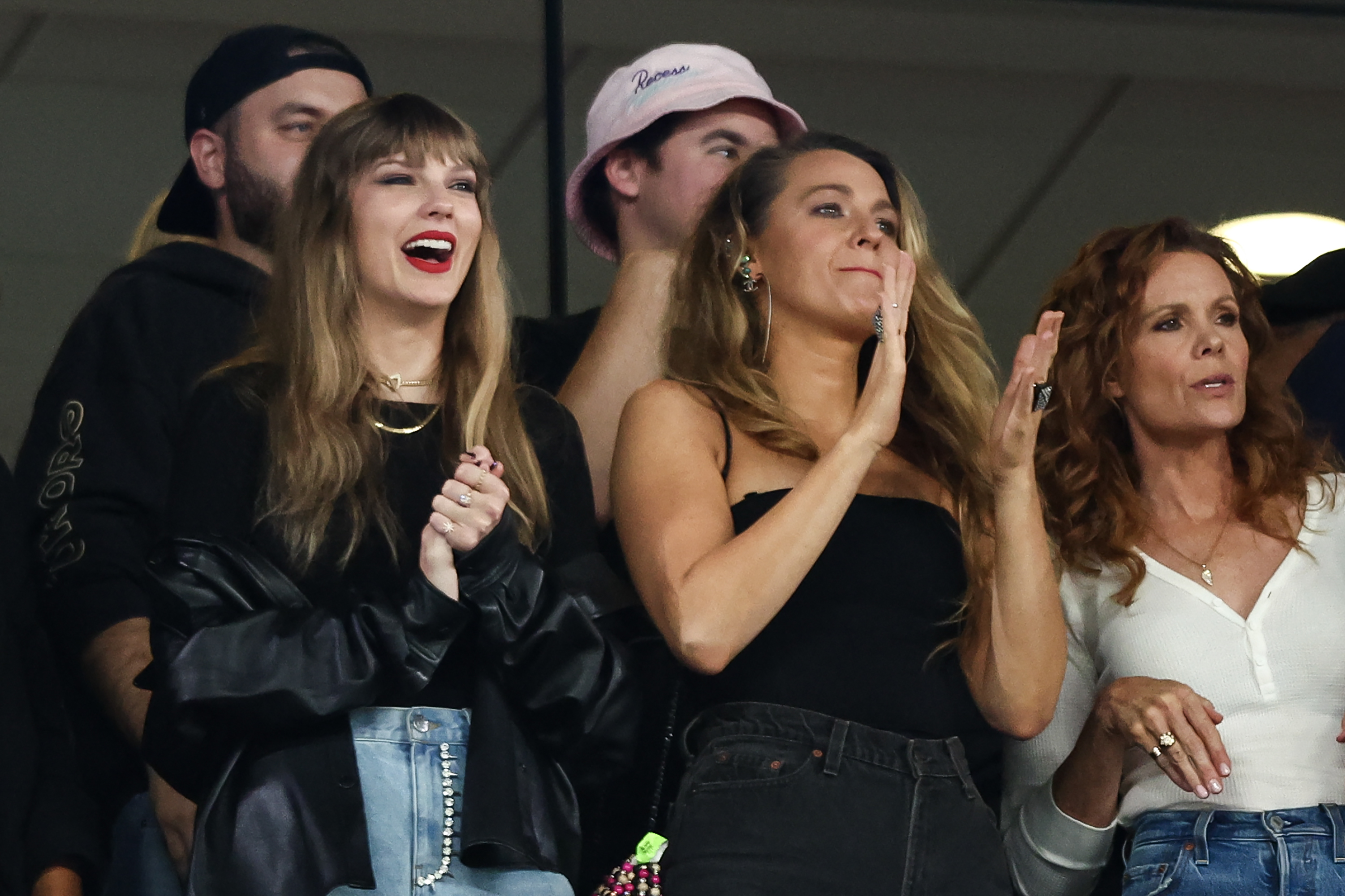 Taylor Swift and Blake Lively cheer from the stands during an NFL football game between the New York Jets and the Kansas City Chiefs at MetLife Stadium on October 1, 2023 in East Rutherford, New Jersey. | Source: Getty Images