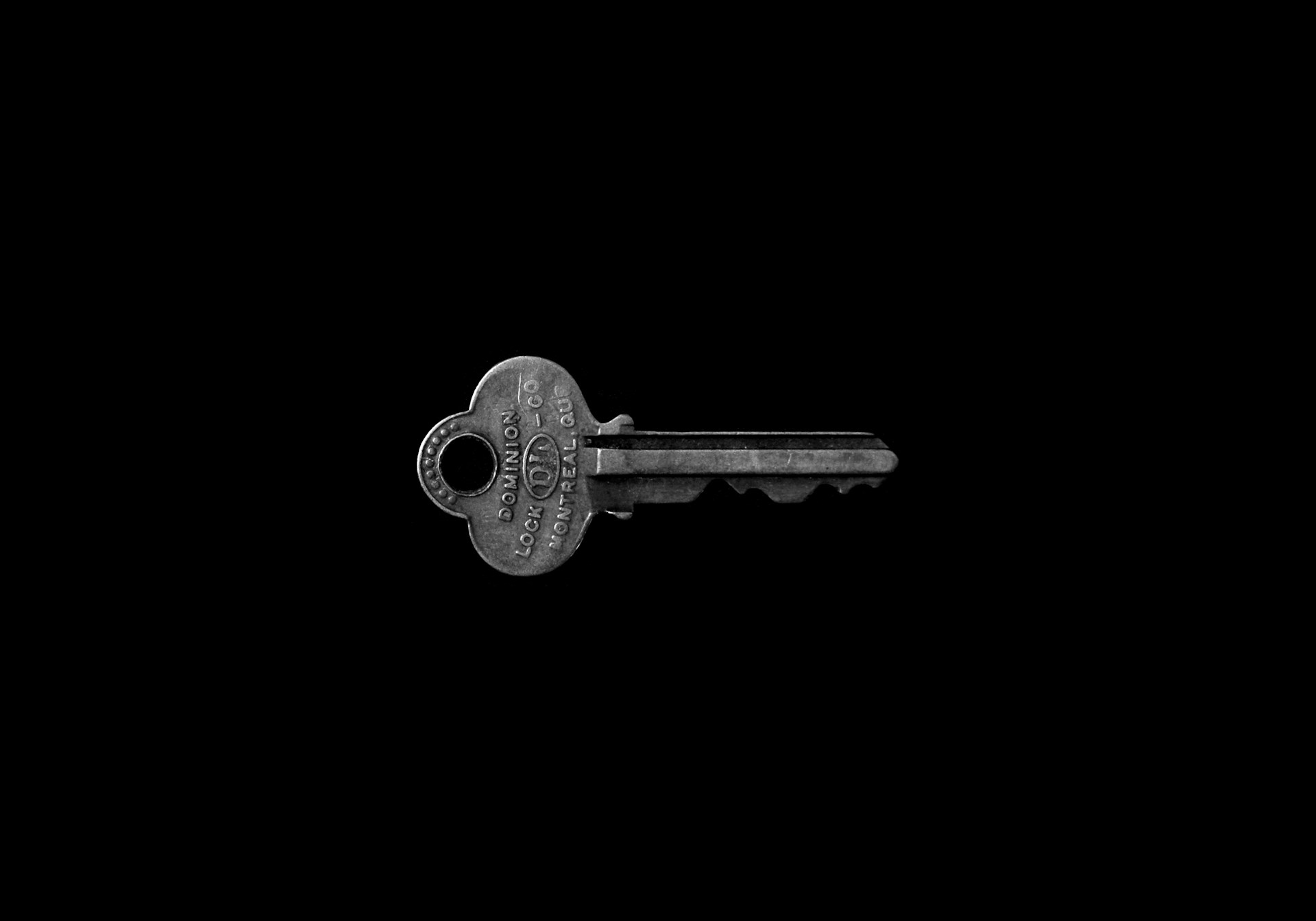 A key on a black surface | Source: Unsplash