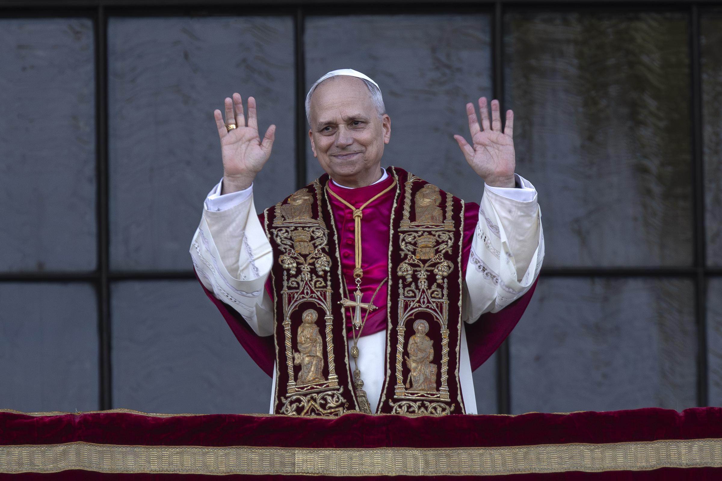 Pope Leo XIV greets the faithful from the central loggia of the Basilica of St. John Lateran in Rome, after presiding over a Mass and taking possession of the Roman Cathedral on May 25, 2025 | Source: Getty Images