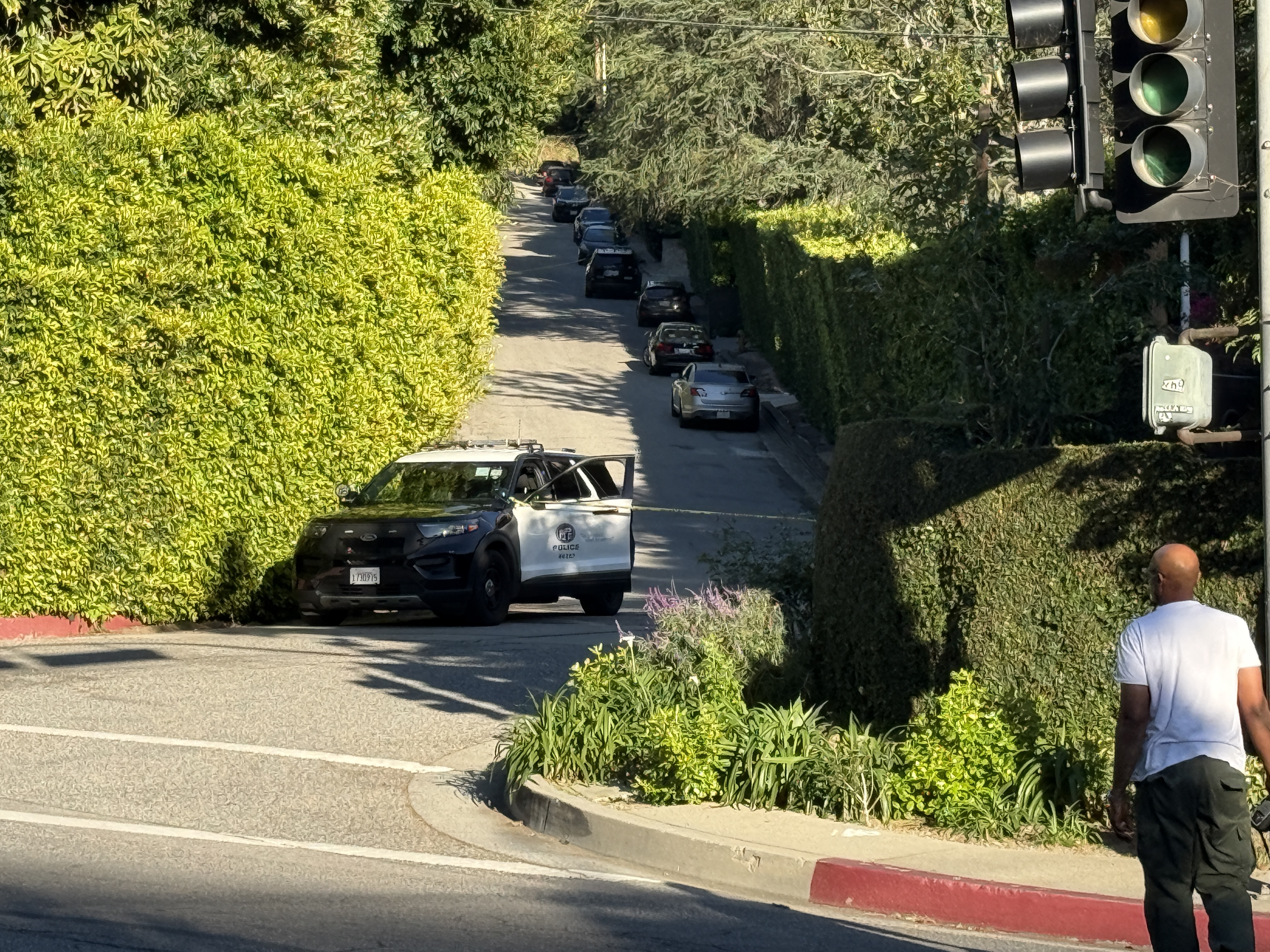 Police are seen outside Rihanna's home after a report of gunshots on March 08, 2026 in Beverly Hills, California. | Source: Getty Images
