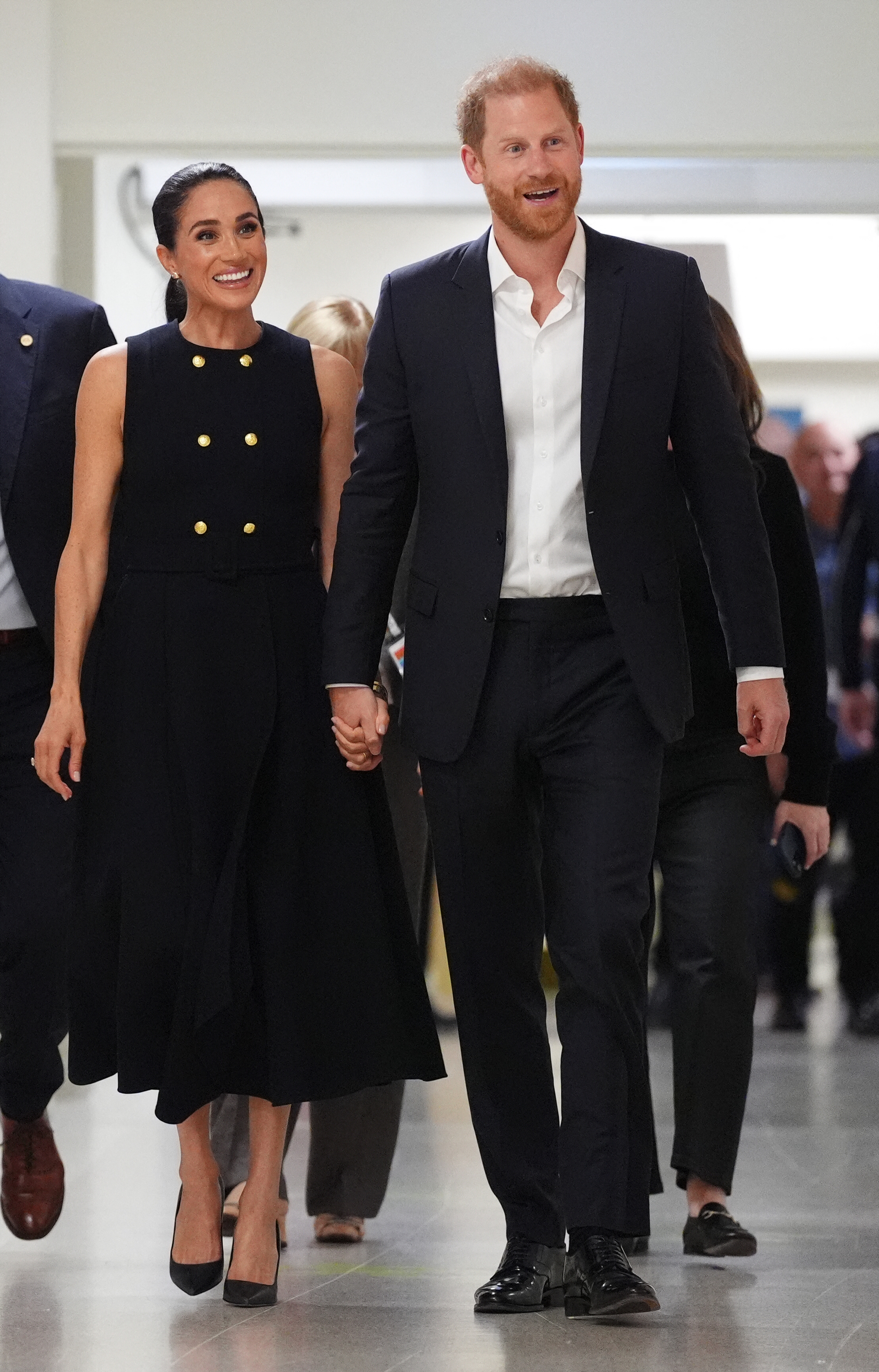 Prince Harry and Meghan Markle walk hand-inhand through the Royal Children's Hospital, smiling as they embark on their first engagement on April 14, 2026 in Melbourne, Australia. | Source: Getty Images