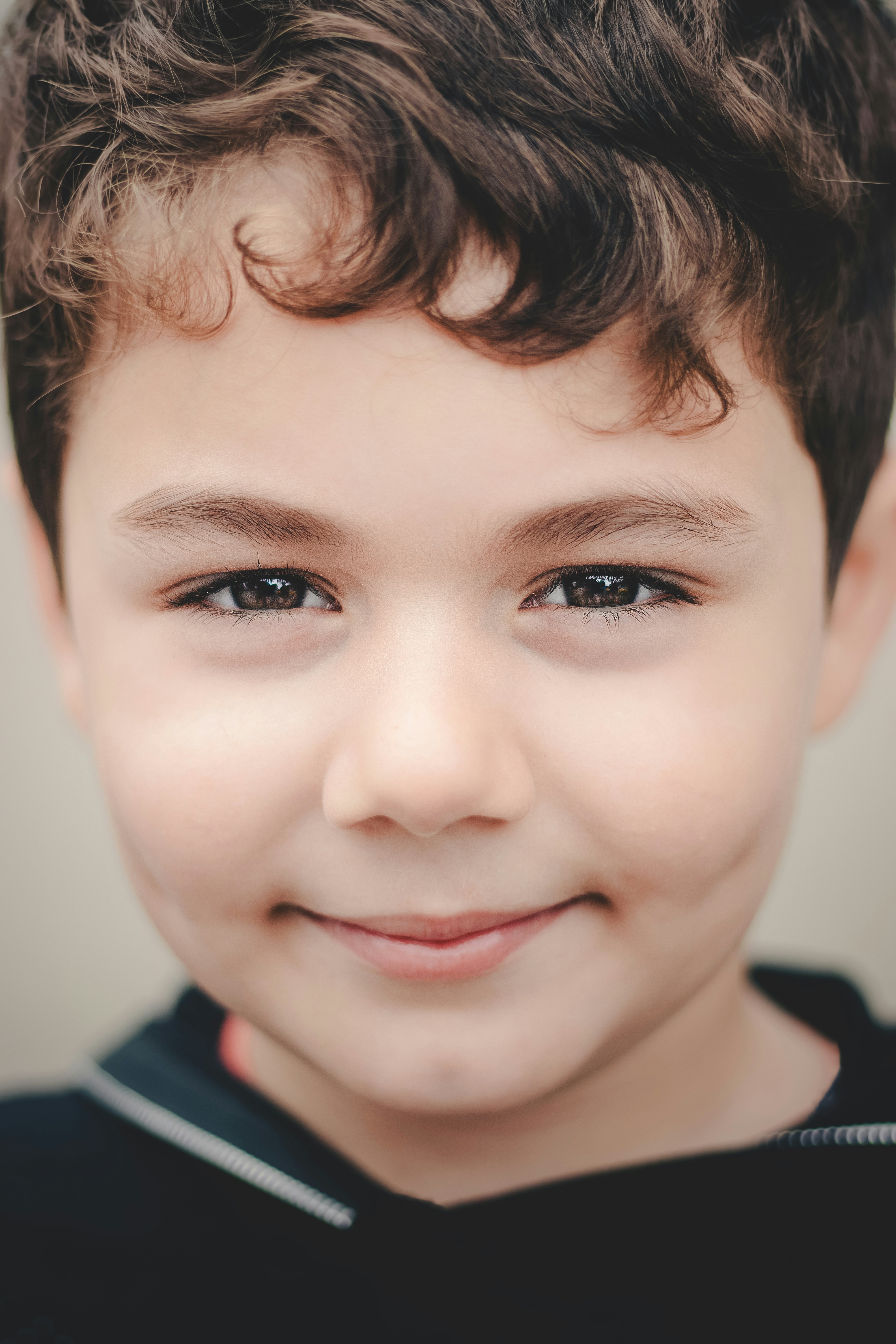 A close-up of a smiling boy | Source: Unsplash