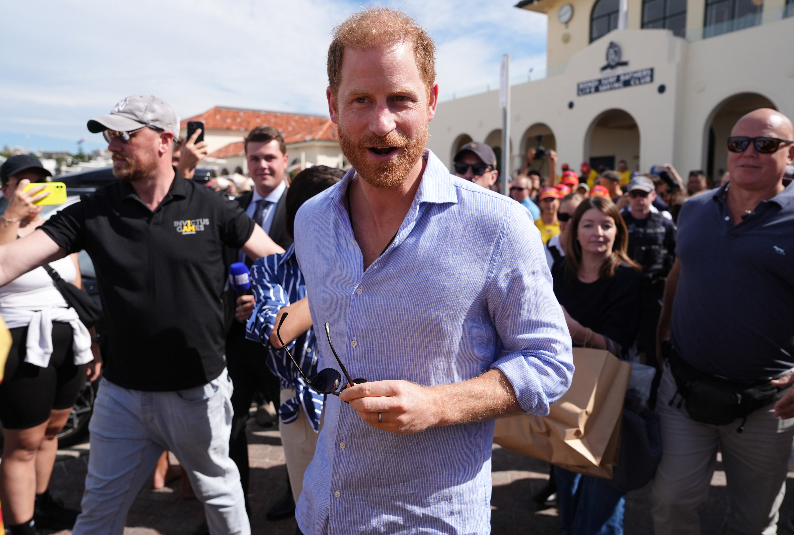 Prince Harry, Duke of Sussex leaves the Bondi Surf Bathers' Life Saving Club after meeting volunteer first responders, during a visit to Bondi Beach, on day four of the royal trip to Australia on April 17, 2026 in Sydney, Australia. | Source: Getty Images