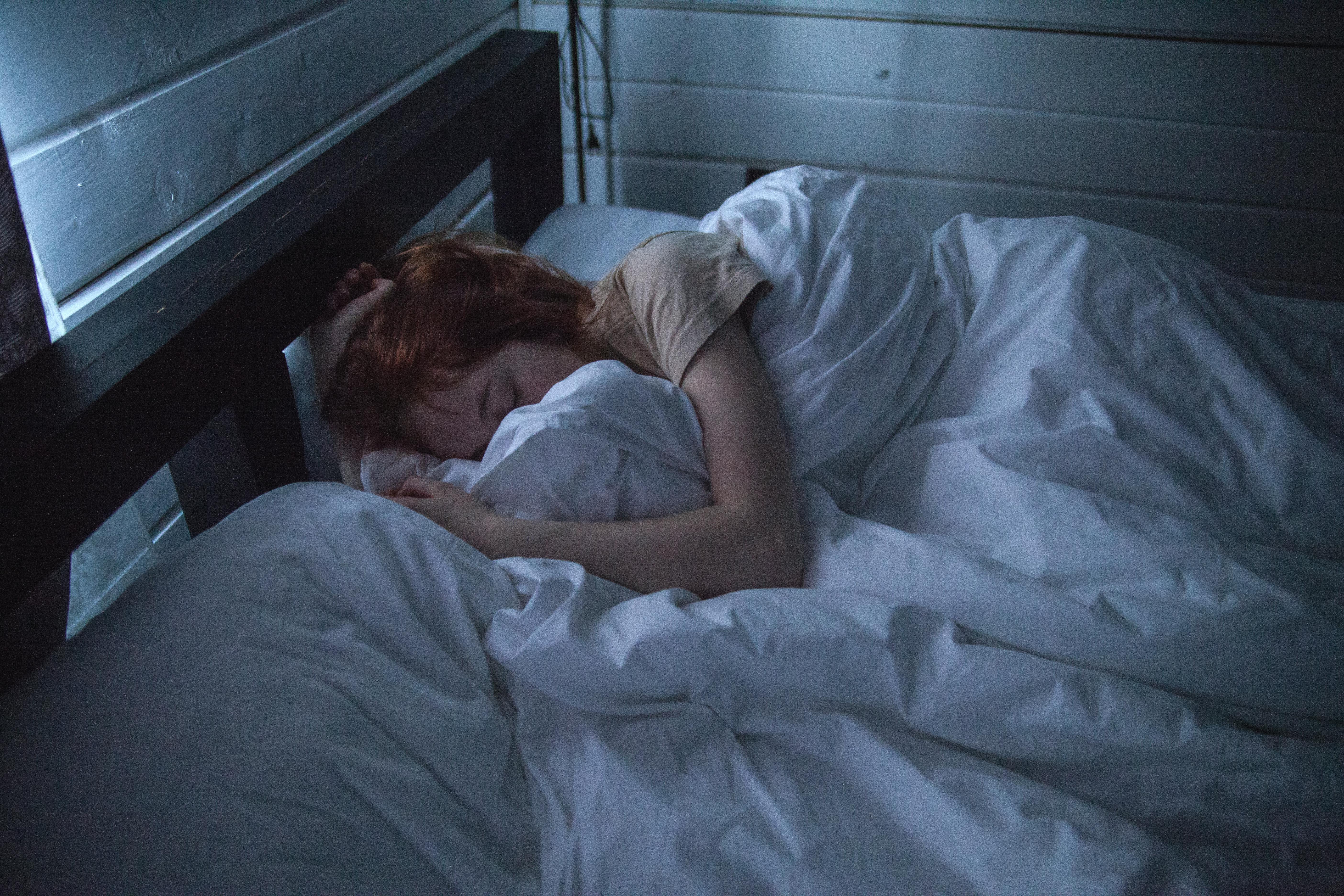 A woman laying in her bed | Source: Pexels