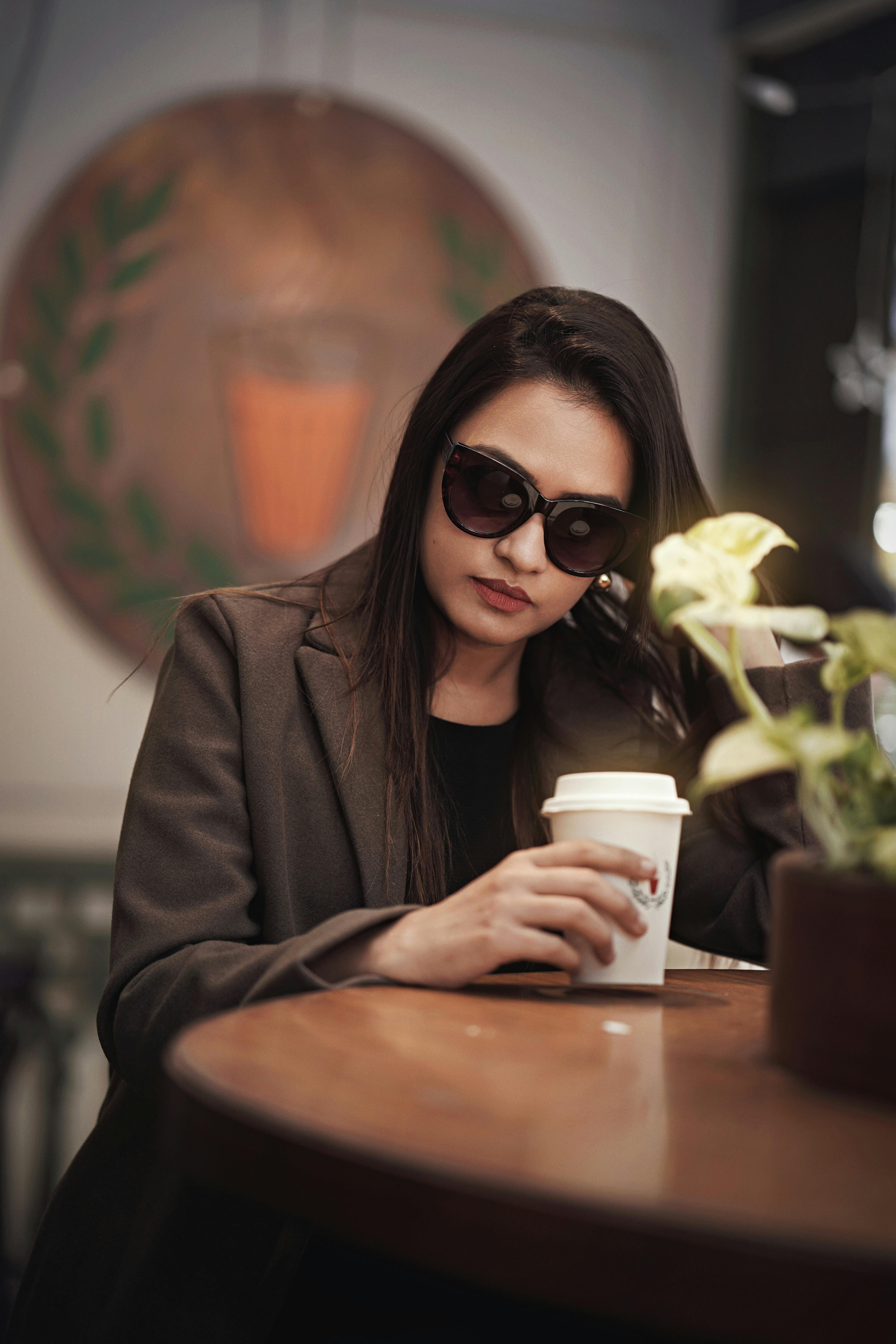Woman having coffee | Source: Pexels
