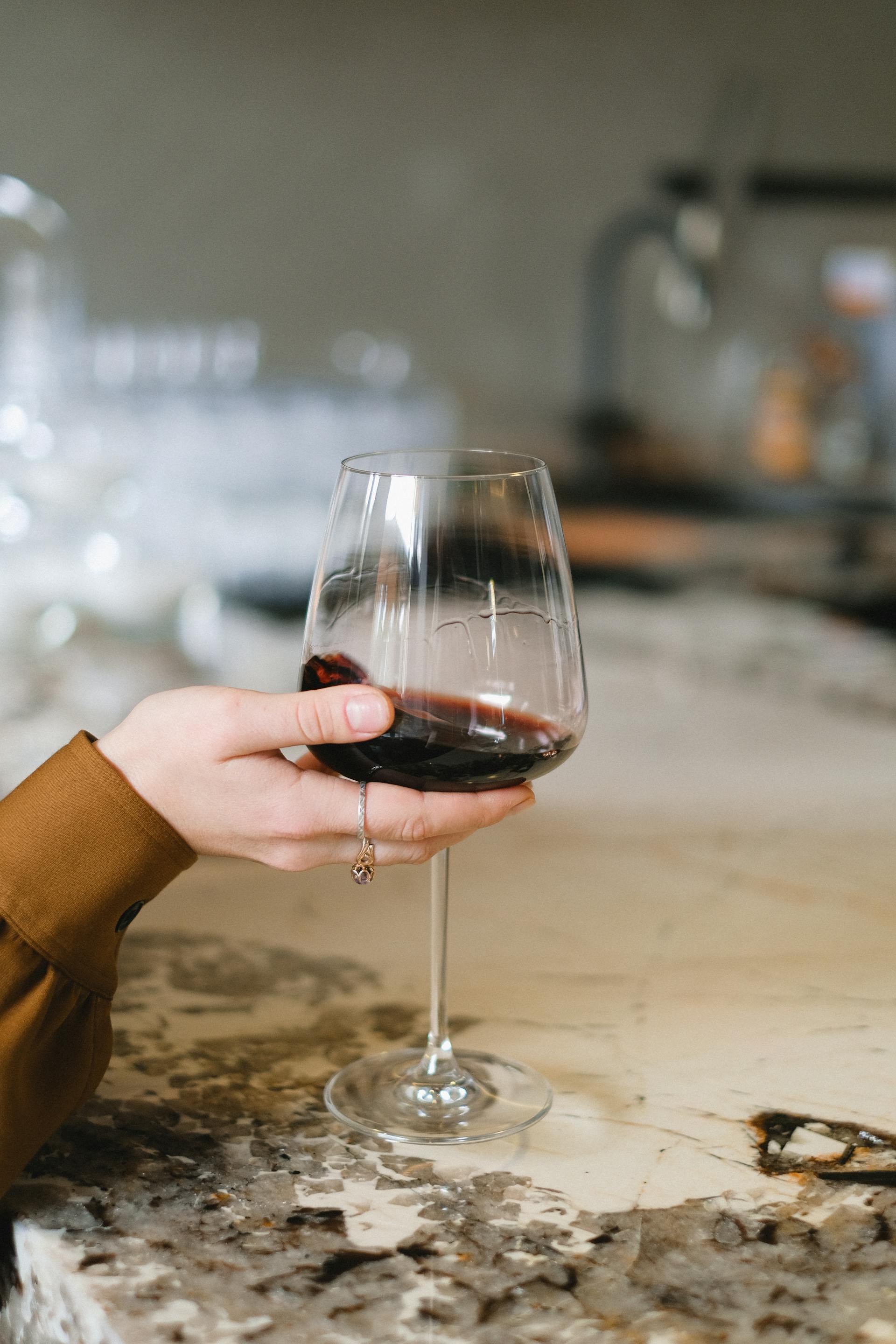 A woman holding a glass | Source: Pexels