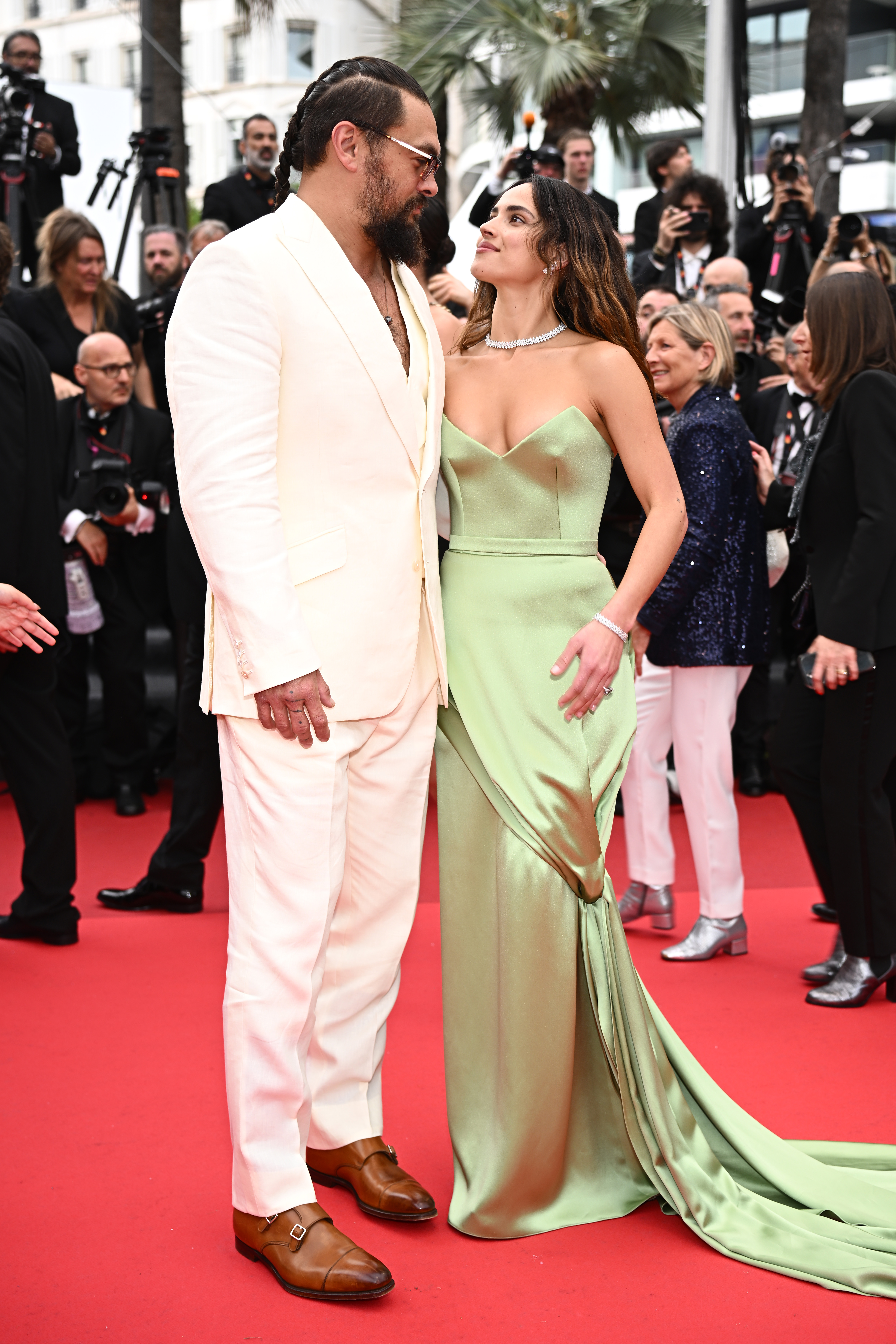 Jason Momoa and Adria Arjona attend the "Highest 2 Lowest" red carpet at the 78th annual Cannes Film Festival at Palais des Festivals on May 19, 2025, in Cannes, France. | Source: Getty Images