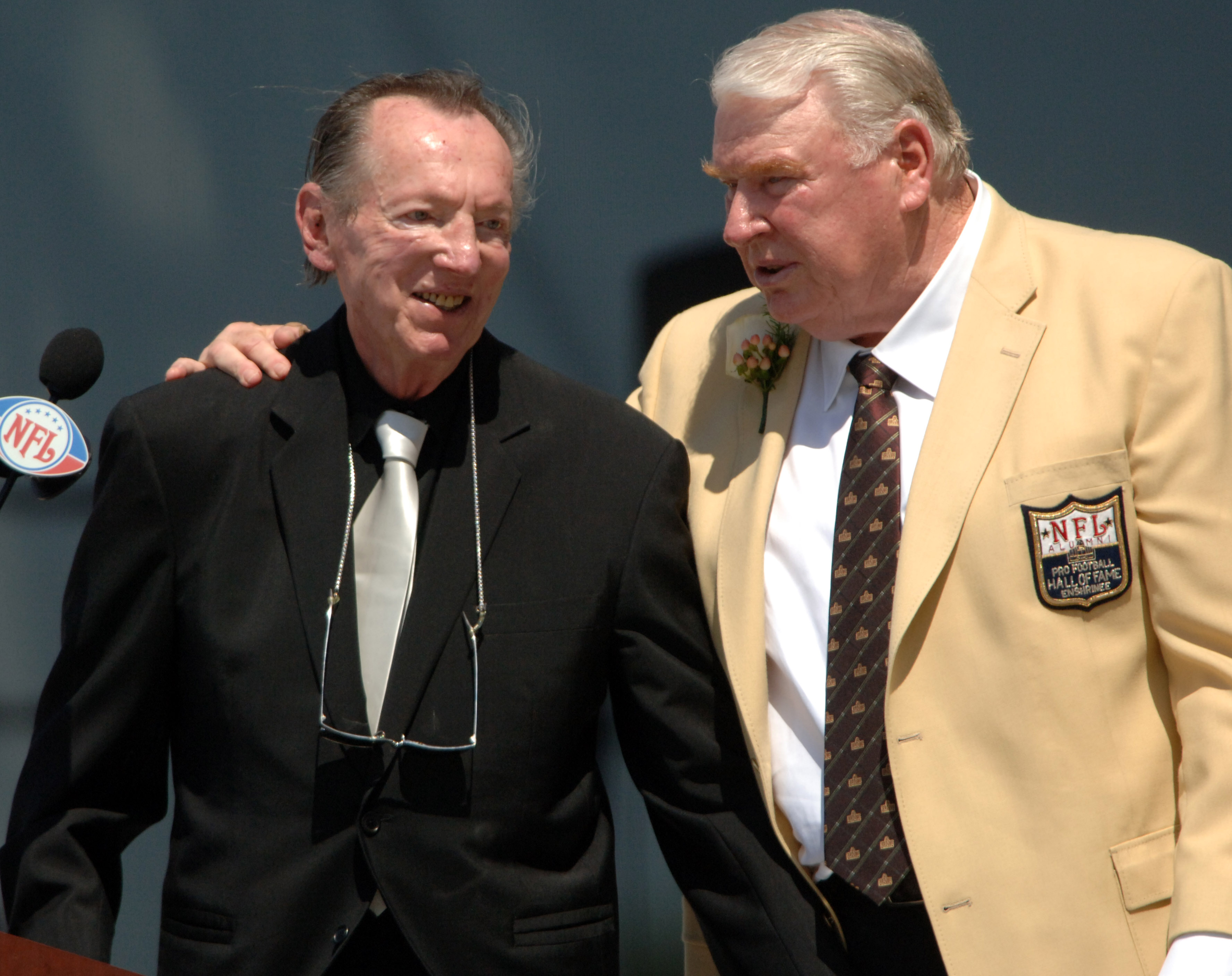 Oakland Raiders owner Al Davis and John Madden at NFL Pro Football Hall of Fame Enshrinement at Fawcett Stadium in Canton, Ohio on Saturday, August 5, 2006 | Source: Getty Images