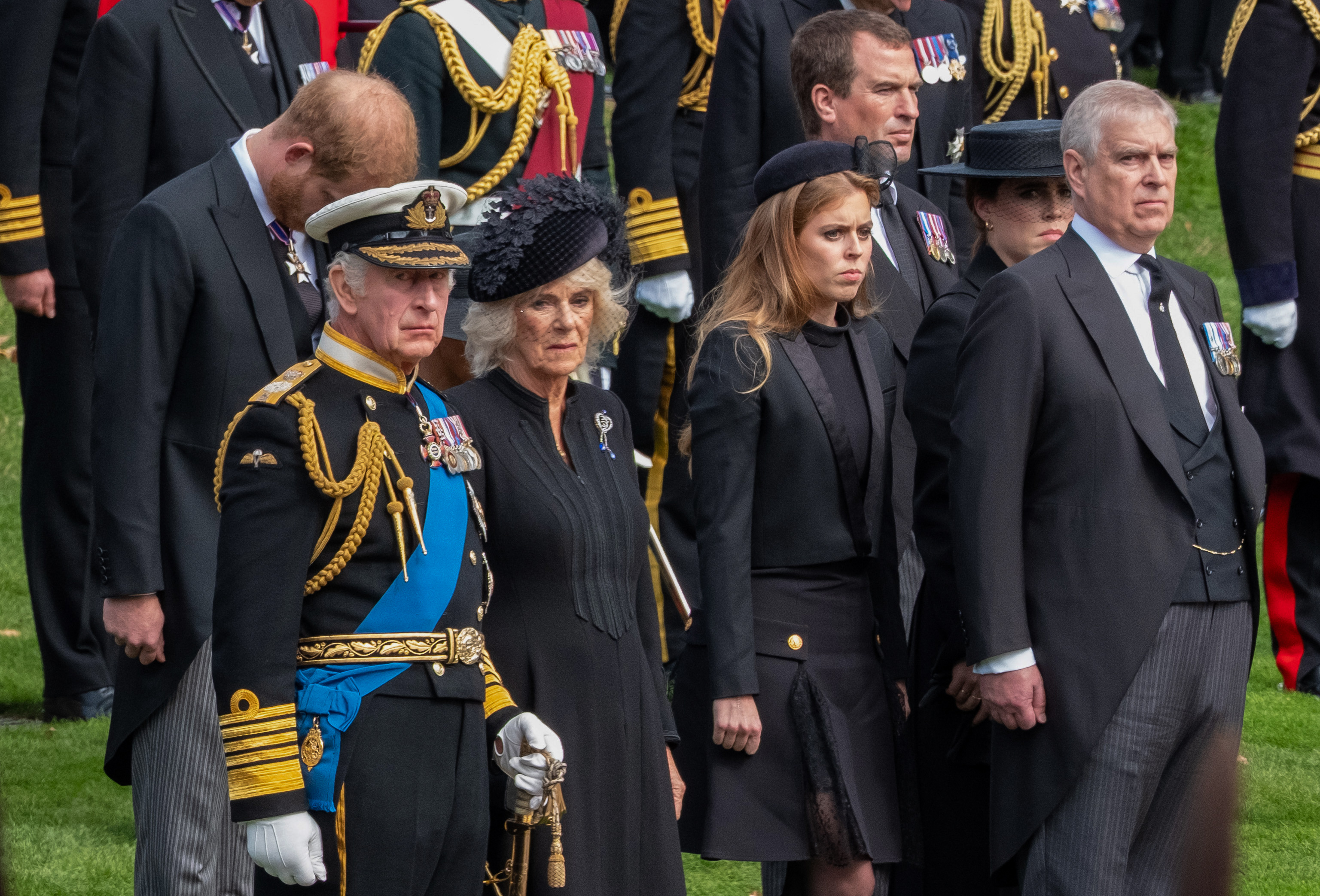 Britain's King Charles III, Camilla the Queen Consort, Prince Harry the Duke of Sussex, Prince Andrew the Duke of York with his daughters Princess Beatrice and Princess Eugenie, and Peter Phillips watch as the coffin of Queen Elizabeth II is carried by gun carriage to Wellington Arch from Westminster Abbey in London, UK, on Monday, September 19, 2022. | Source: Getty Images