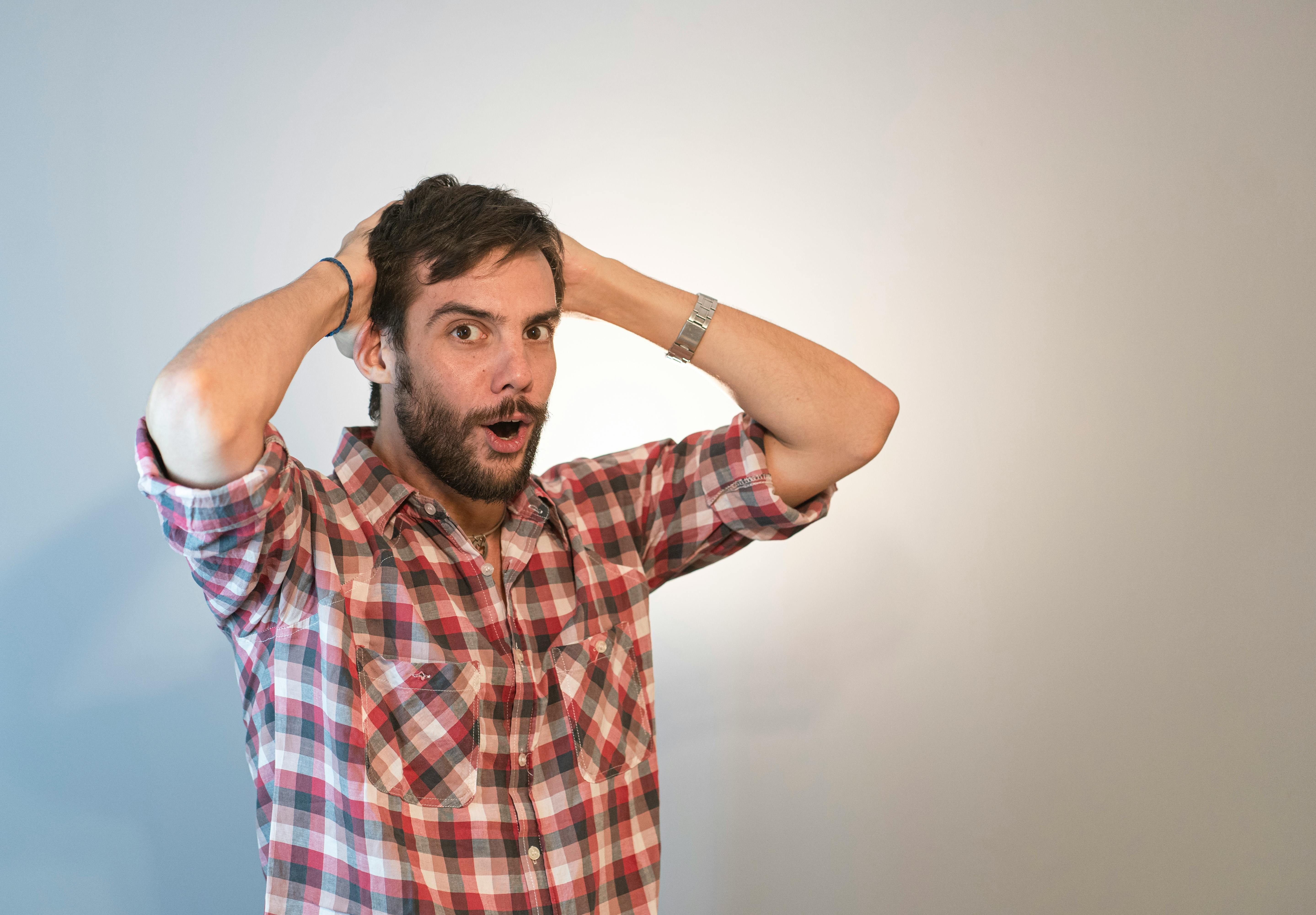 Shocked man with his hands on his head | Source: Pexels