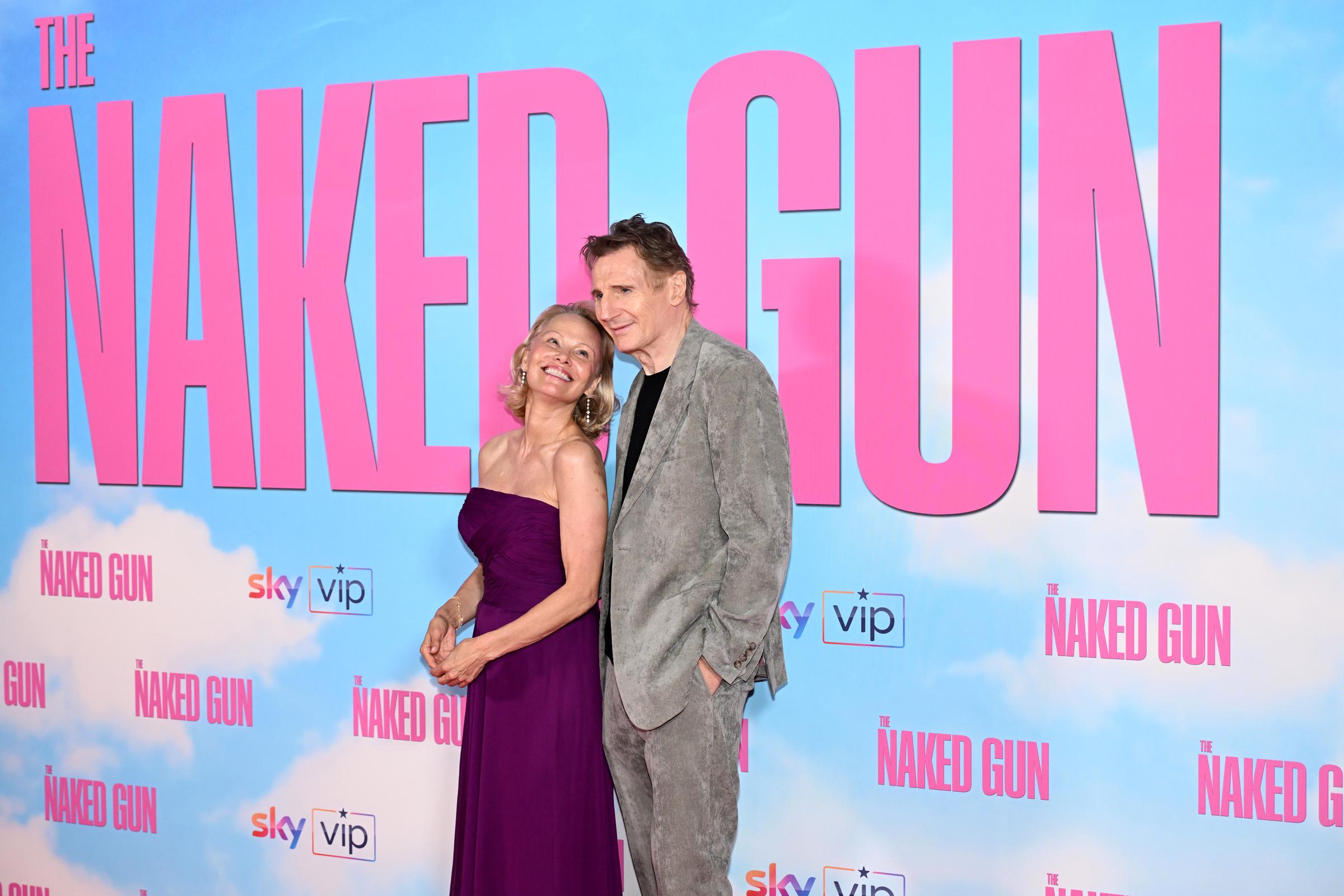 Pamela Anderson and Liam Neeson attend "The Naked Gun" UK Premiere at Cineworld Leicester Square on July 22, 2025, in London, England. | Source: Getty Images