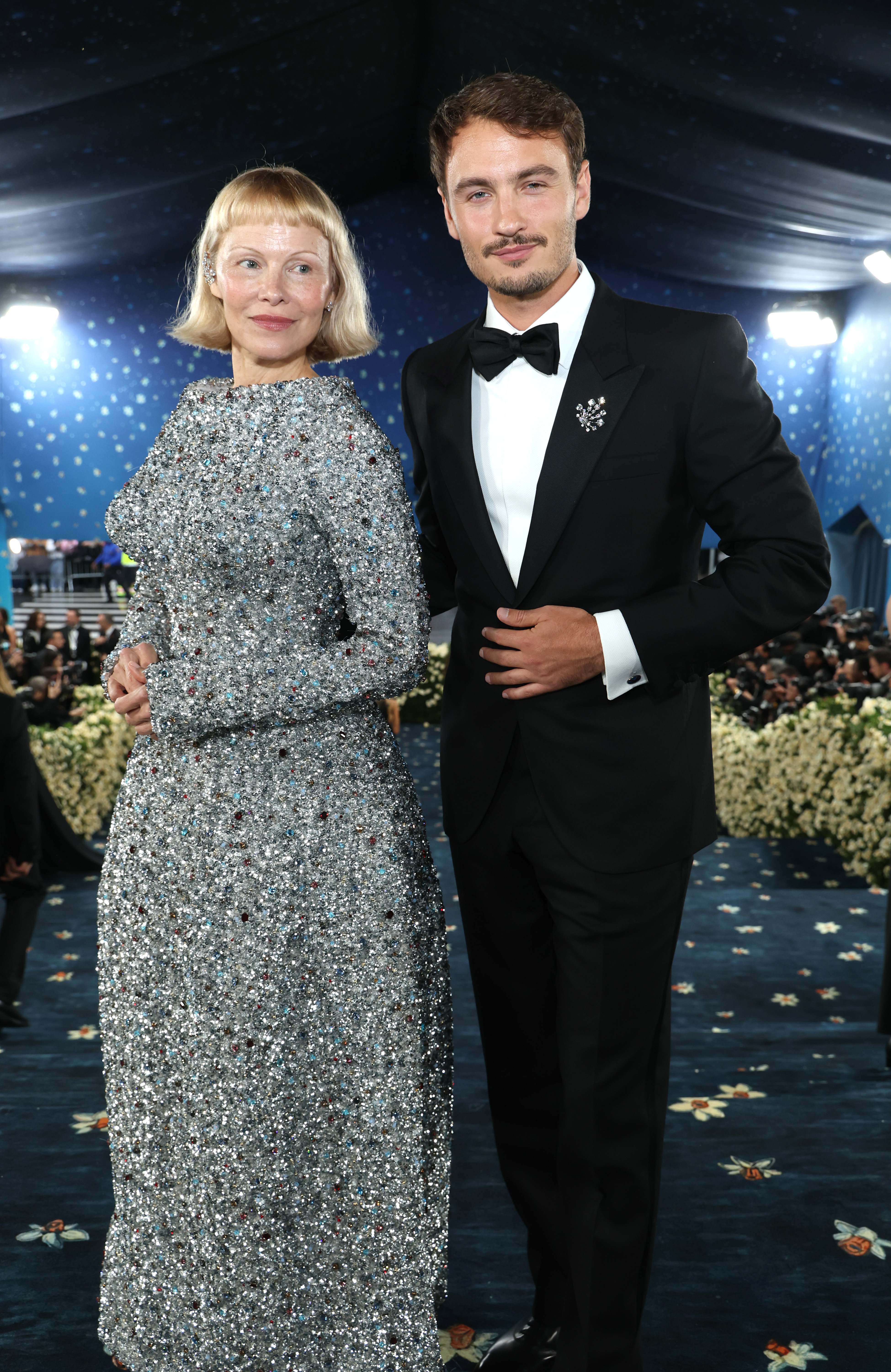 Pamela Anderson and Brandon Thomas Lee attend the 2025 Met Gala Celebrating "Superfine: Tailoring Black Style" at Metropolitan Museum of Art on May 5, 2025, in New York City. | Source: Getty Images
