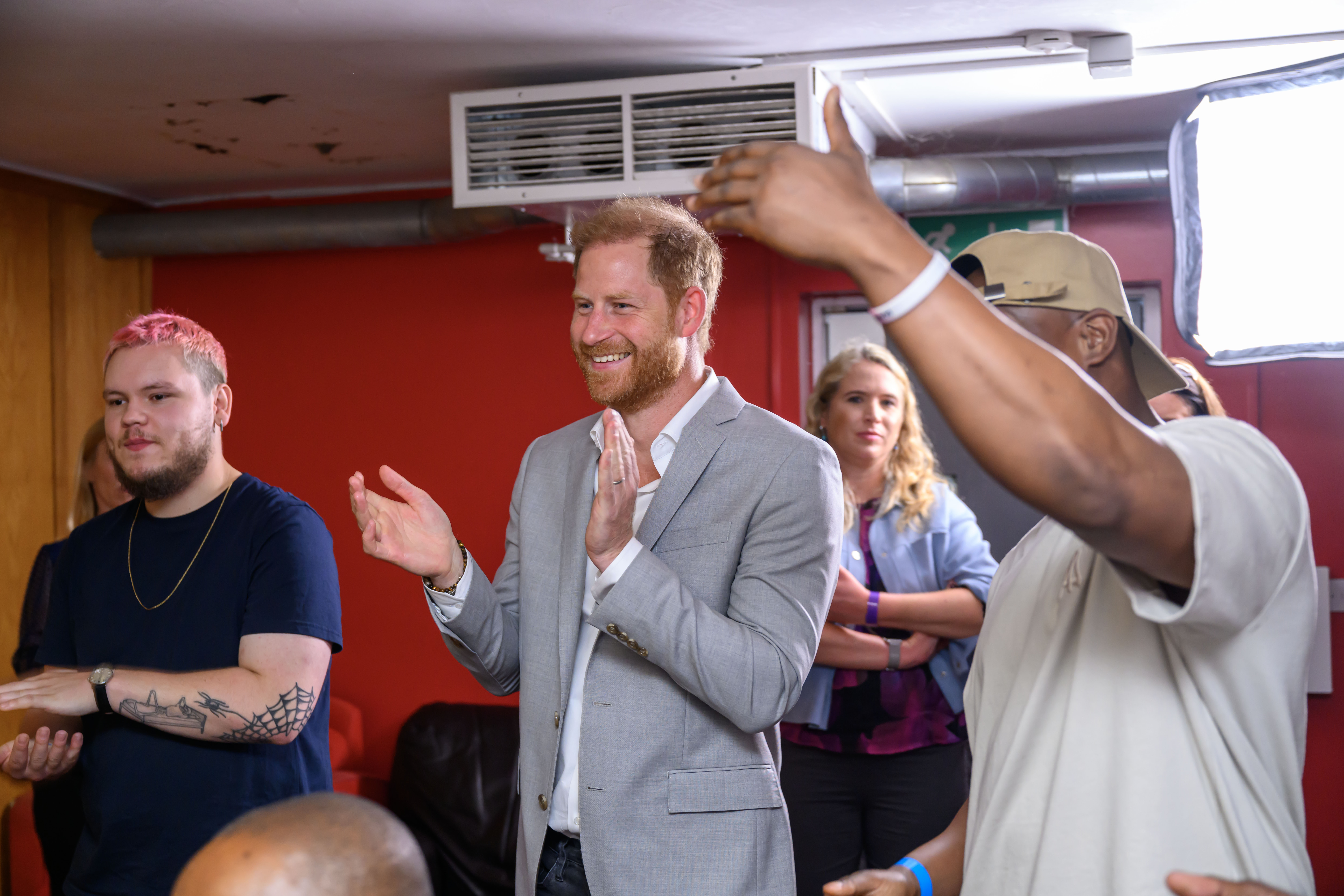 Prince Harry in a recording studio reacting to a performance by a rapper named Paige during a visit to the community recording studio in St. Ann's on September 9, 2025, in Nottingham, England. | Source: Getty Images