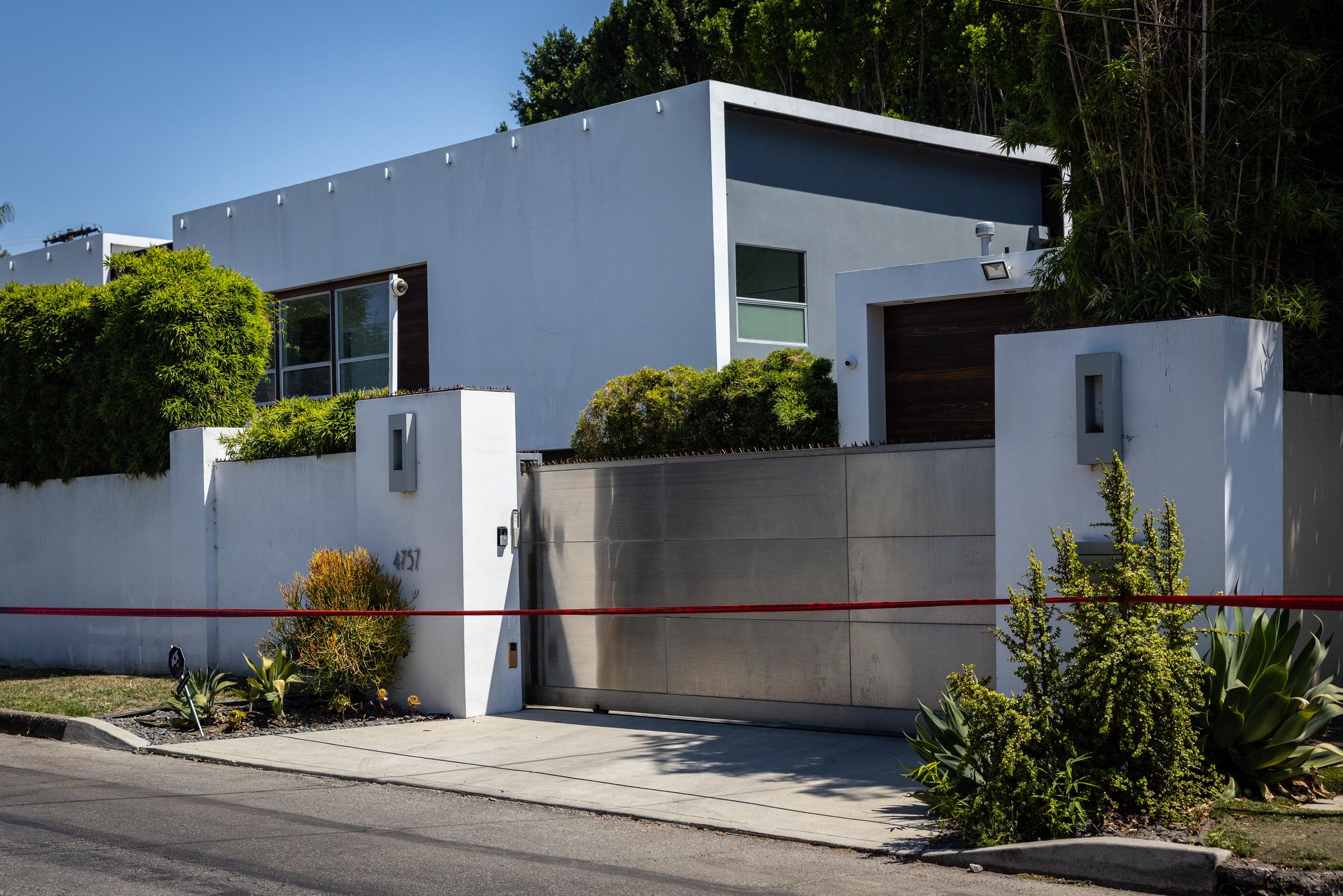 Los Angeles Police Department officials secure the home where Robin Kaye, an "American Idol" music supervisor, and her husband, Thomas Deluca, were found killed with gunshot wounds to the head on Tuesday, July 15, 2025, in Encino, California. | Source: Getty Images