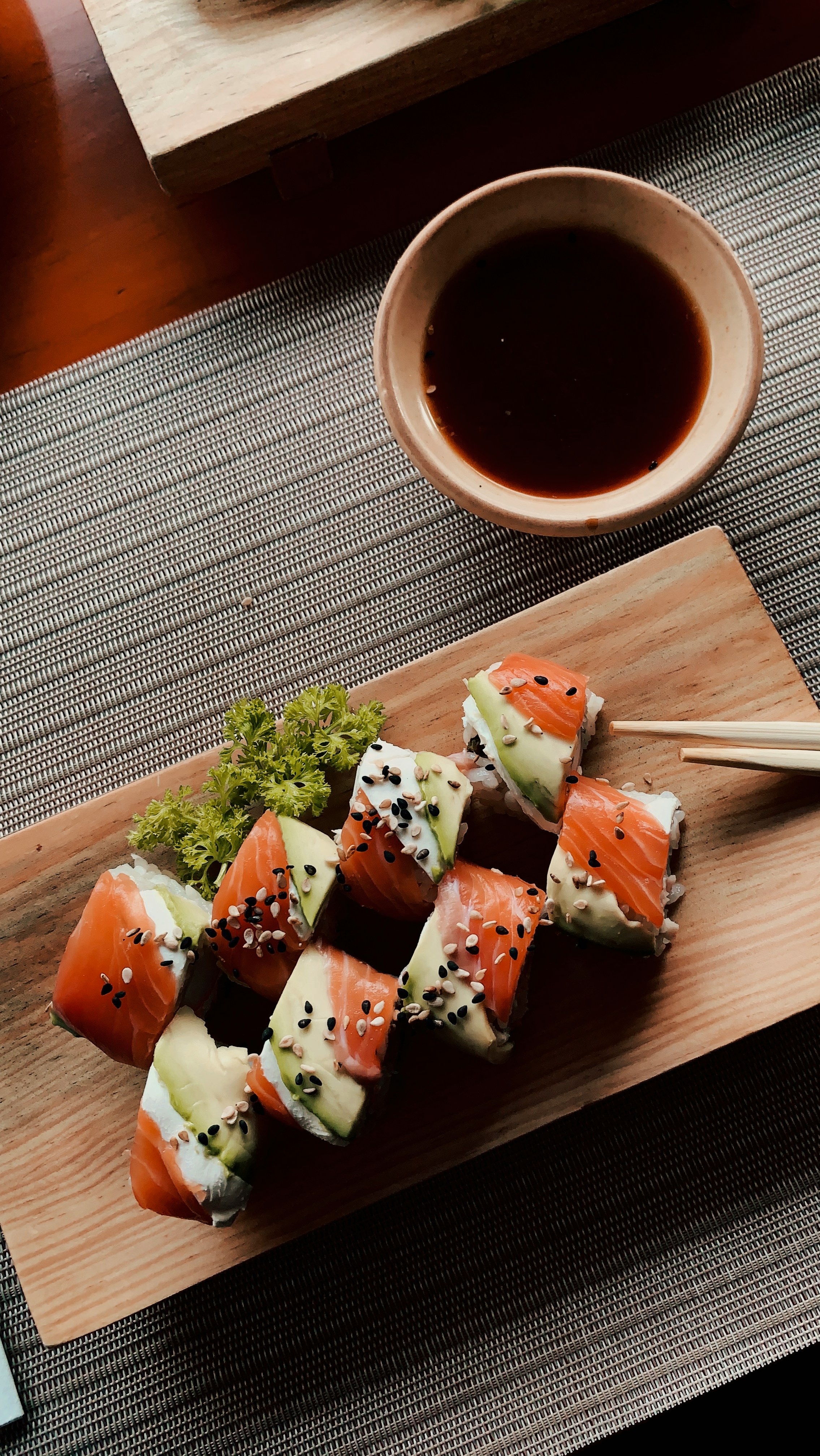 Sushi rolls on wooden board | Source: Unsplash