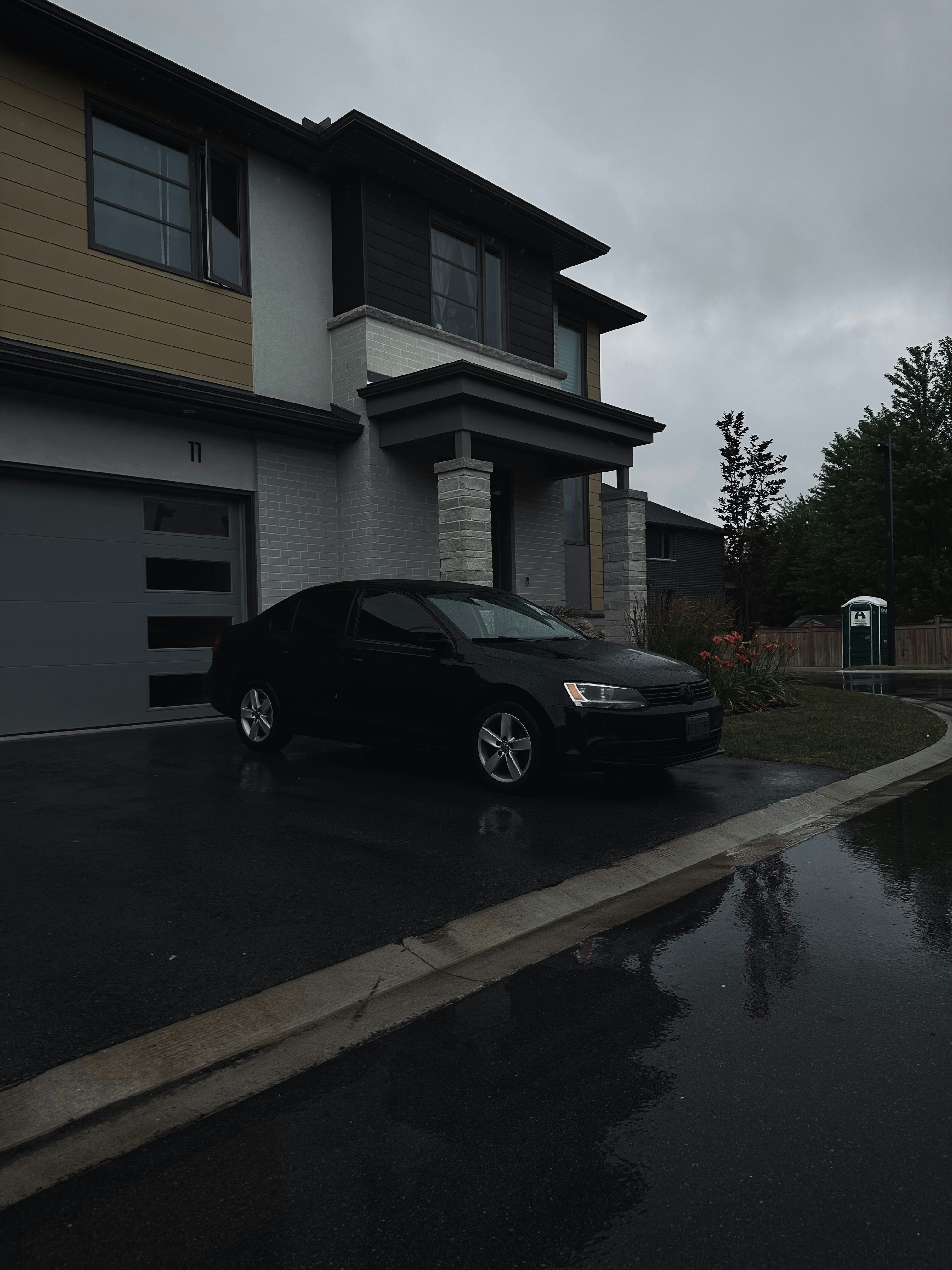 A car parked in front of a house | Source: Unsplash