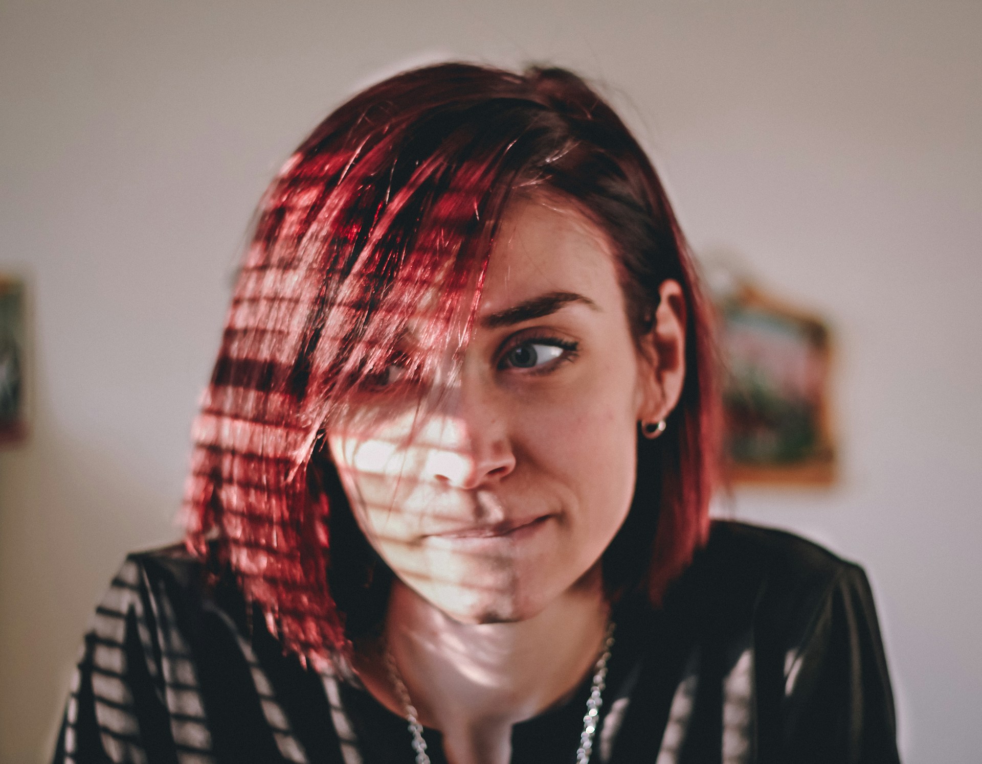 A woman biting her lip doubtfully | Source: Unsplash