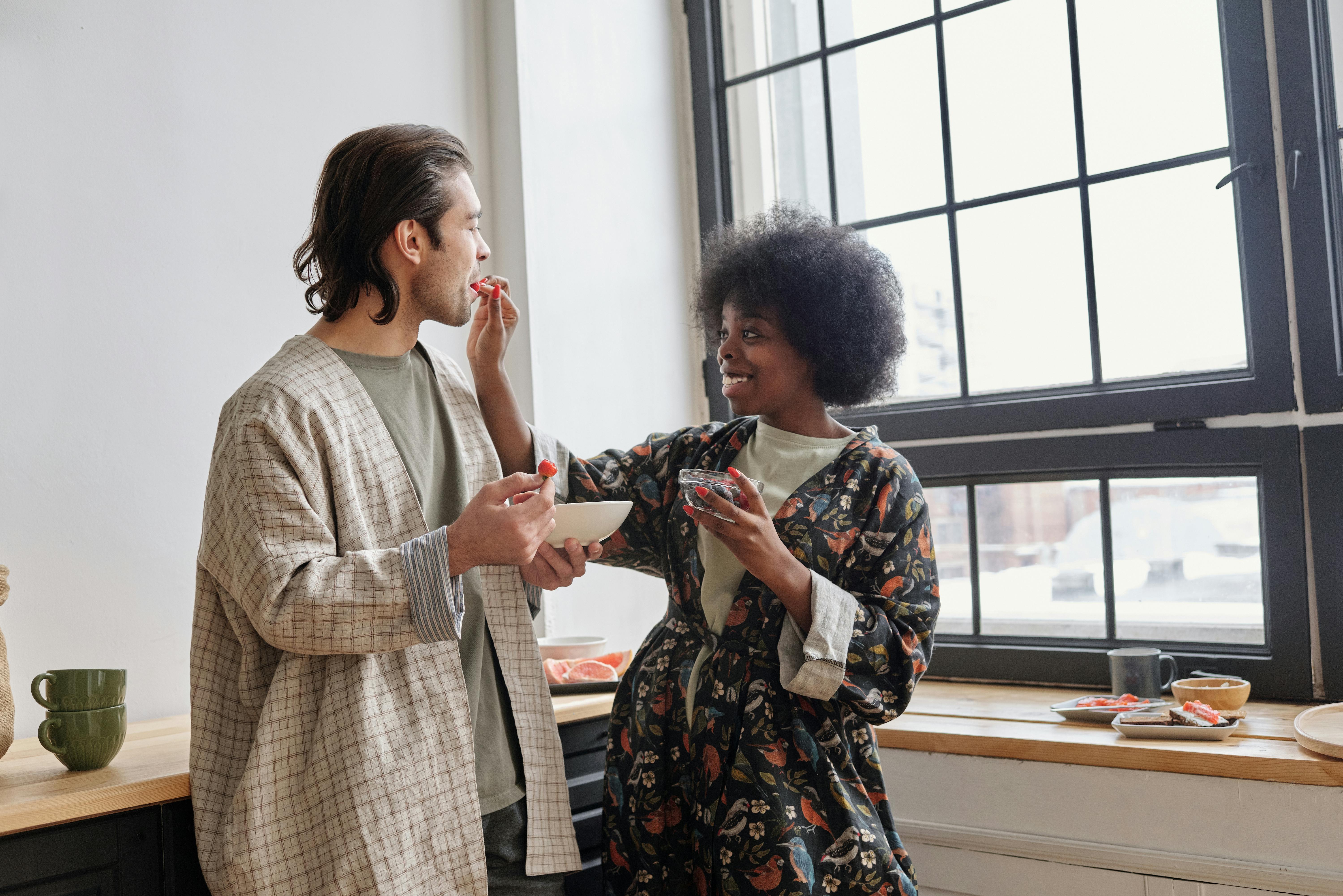 A woman feeding a man | Source: Pexels