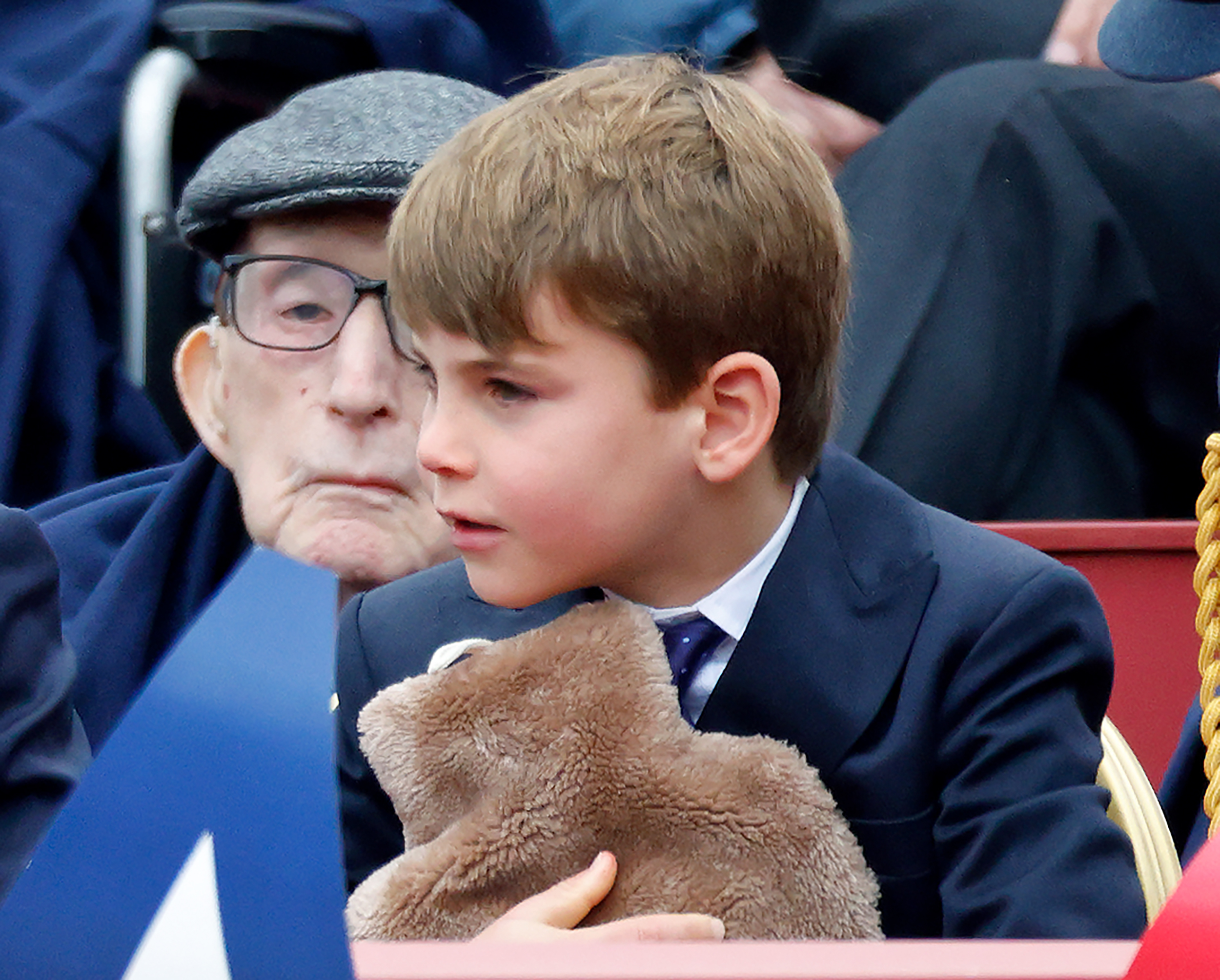 Prince Louis of Wales holds a hot water bottle as he attends a military procession, down The Mall, to mark the 80th anniversary of VE Day on May 5, 2025, in London, England. | Source: Getty Images
