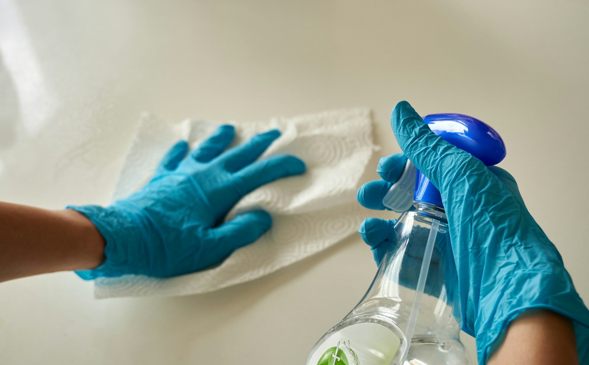 A person cleaning a countertop | Source: Unsplash