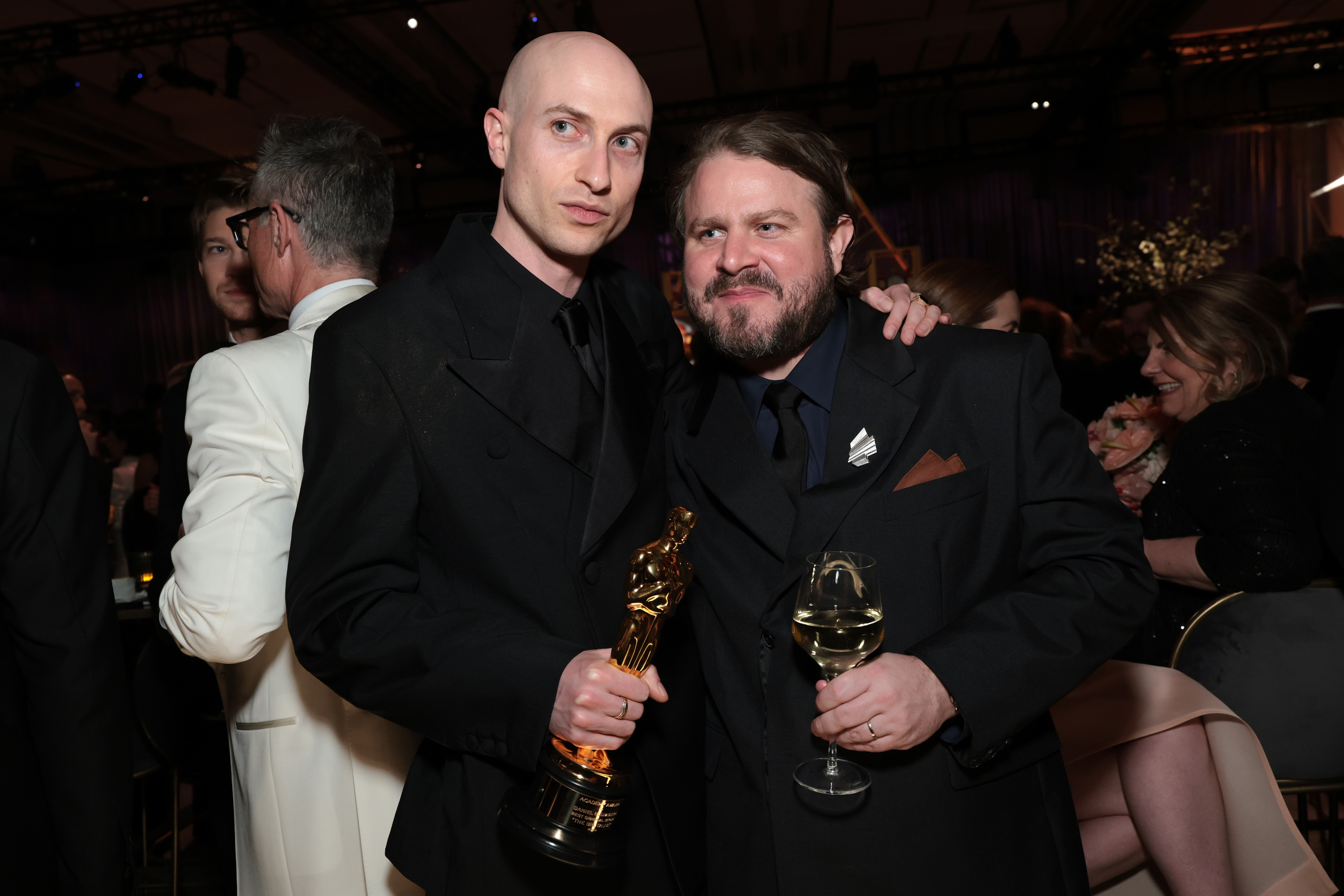 Daniel Blumberg, winner of Best Original Score for "The Brutalist," and Brady Corbet attend the 97th Annual Oscars Governors Ball at Ovation Hollywood Complex on March 02, 2025 in Hollywood, California | Source: Getty Images